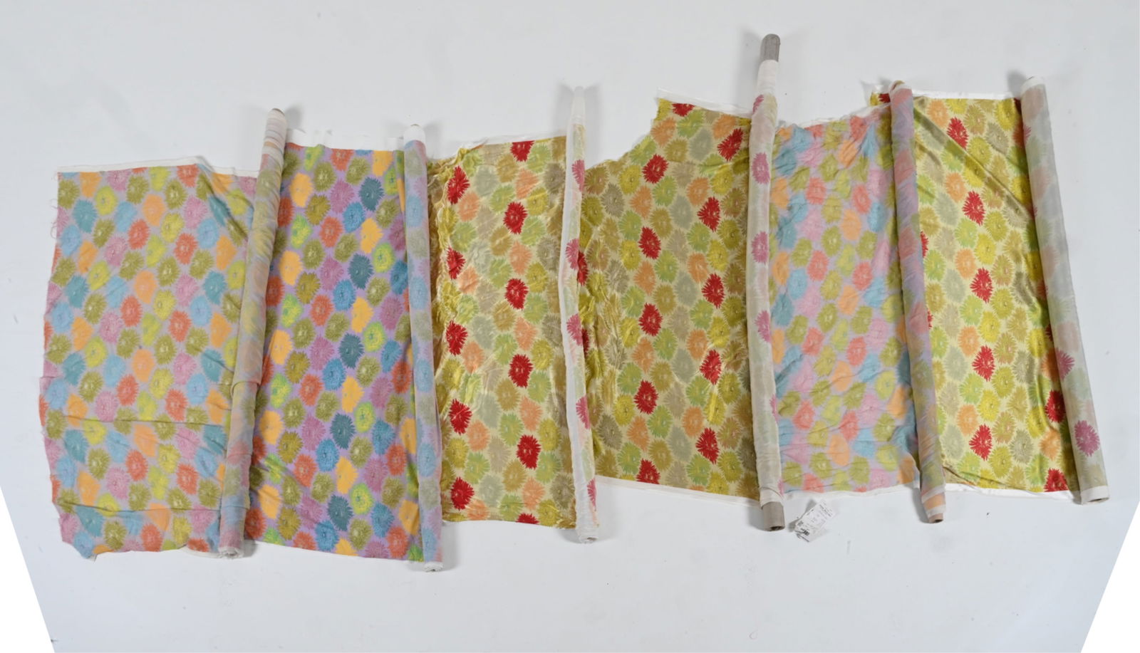 OVER 15 YARDS OF CUSTOM PRINTED SILK FABRICS: Silk satin and silk chiffon, with multicolor chrysanthemum flower print. One roll with original order label from Frangi S.P.A., Italy, stating fabric content of 100% silk. Dimensions: (Largest roll) L