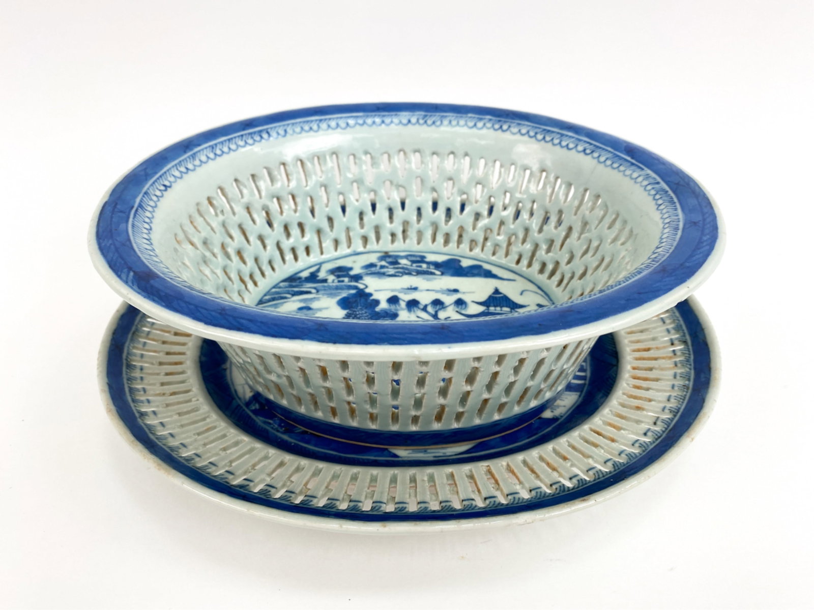 CHINESE EXPORT RETICULATED BOWL & UNDERPLATE: Both unmarked. Blue and white. Dimensions: (Underplate) H 1.5" x W 11" x D 9.75" Condition: Minor glaze flaws.