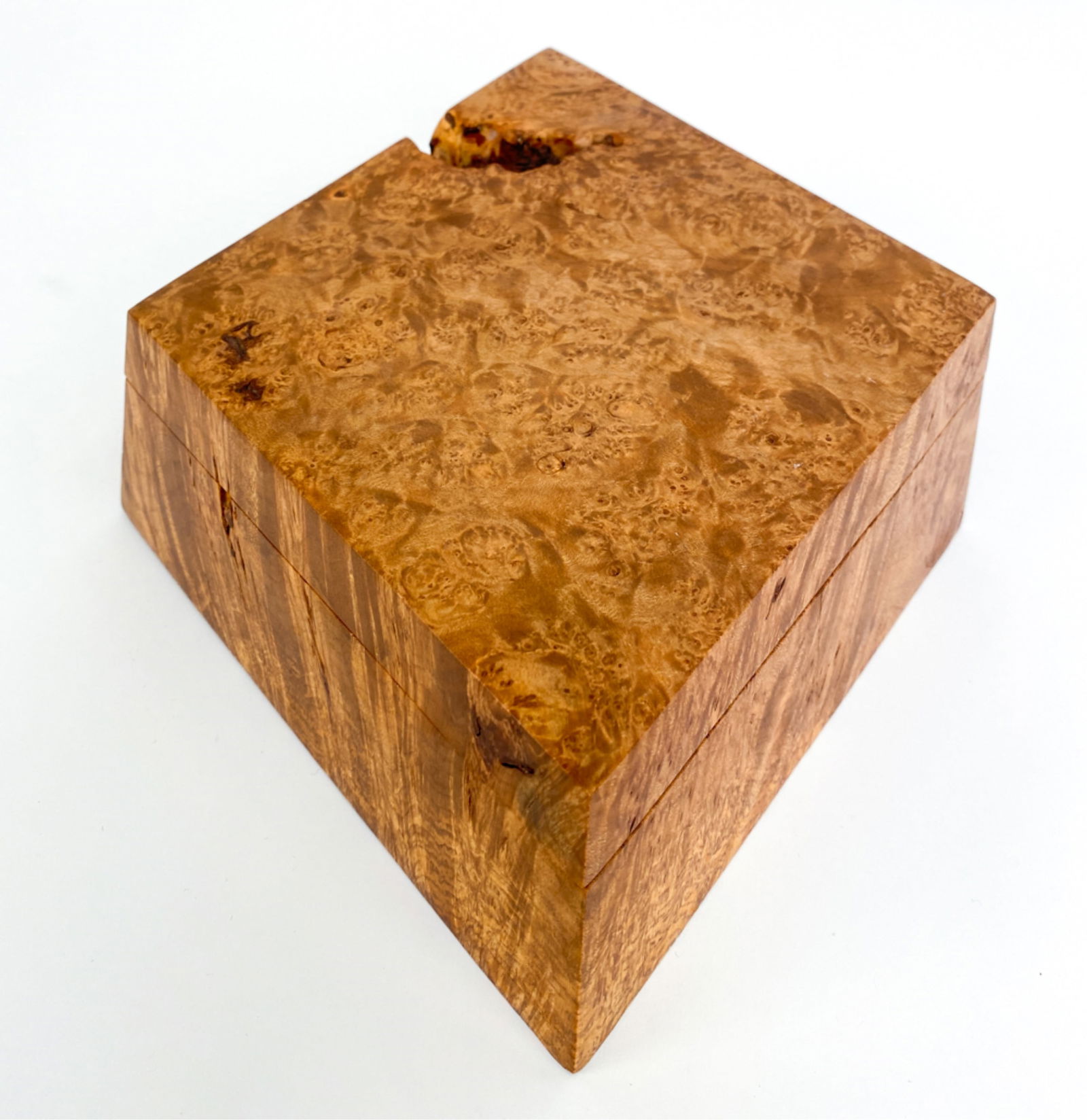 MICHAEL ELKAN BIRDSEYE MAPLE BURL BOX: Burlwood box of one pieces, opens to three compartments. Includes artist tag. Dimensions: H 3" x W 9" x D 8.5" Condition: Slightly uneven finish.