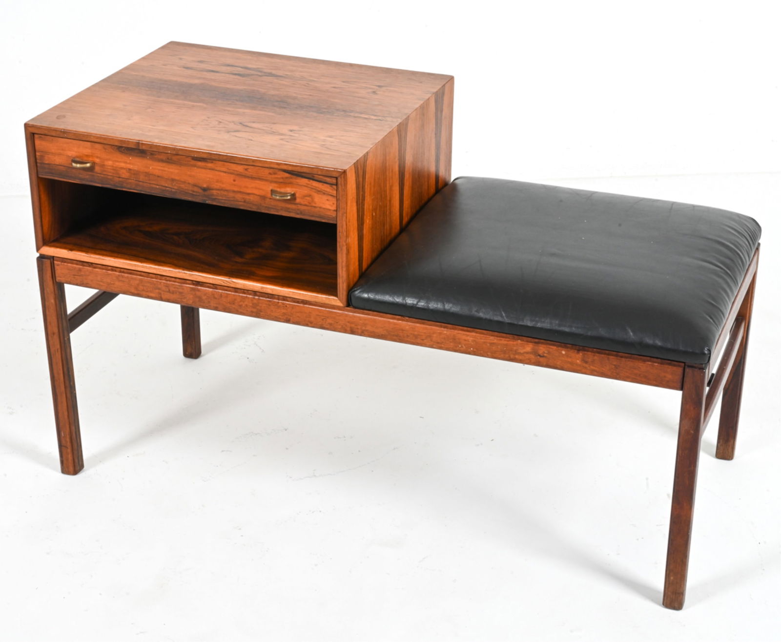 ENGSTROM & MYRSTRAND ROSEWOOD "CASINO" BENCH: Rare Model "Casino" telephone table or hall bench in rosewood and bonded leather, designed by Sven Engstrom and Gunnar Myrstrand for Tingstrom, Sweden, c. 1960's. Stamped underneath. Dimensions: H 23.