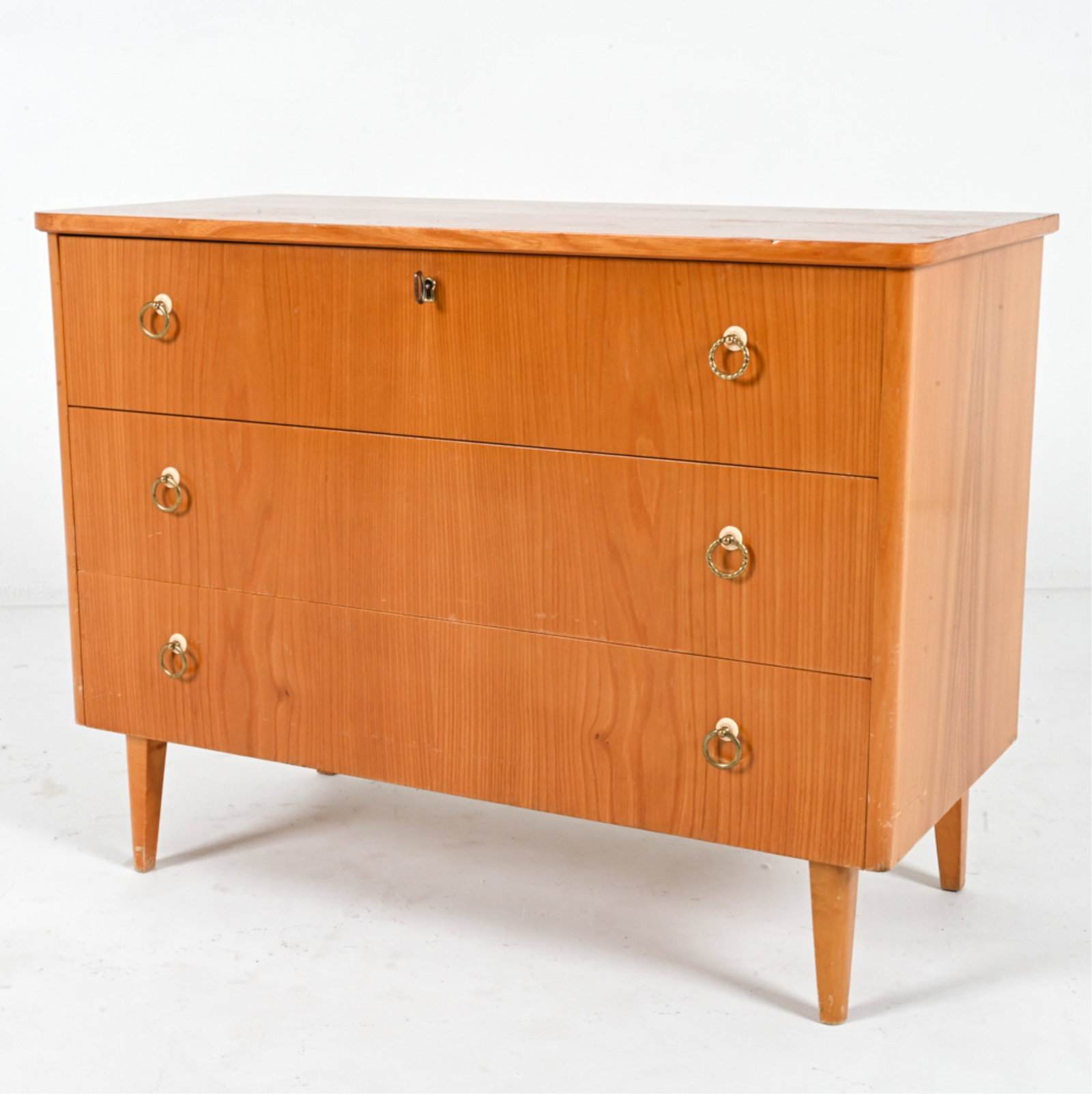 SWEDISH EARLY MODERN ELM CHEST OF DRAWERS: Swedish Art Moderne / Early Modern chest of drawers in elm, with decorative pulls. Key included. Circa 1940's. Dimensions: H 27" x W 35" x D 16". Condition: Scattered scratches and scuffs to finish. L
