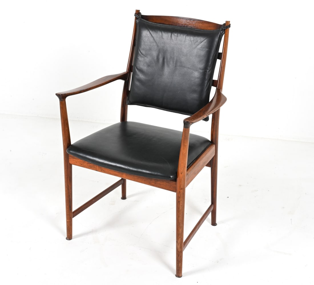 ARNE VODDER VAMO ROSEWOOD & LEATHERETTE ARMCHAIR: Rare armchair in rosewood and black leatherette, designed by Arne Vodder for Vamo Mobler. Stamped underneath. Denmark, c. 1960's. Dimensions: H 36" x W 23" x D 22" x SH 18.5". Condition: Frame with a