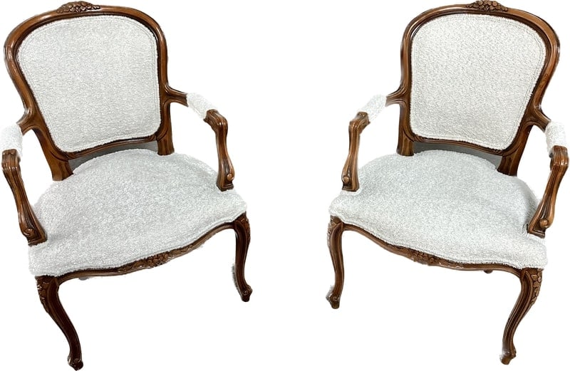 PAIR OF FRENCH LOUIS XV STYLE OAK ARMCHAIRS: In new off-white boucle upholstery. Dimensions: H 35" X W 22.4" X D 24" X SH 16.9" Condition: Renewed vintage condition.