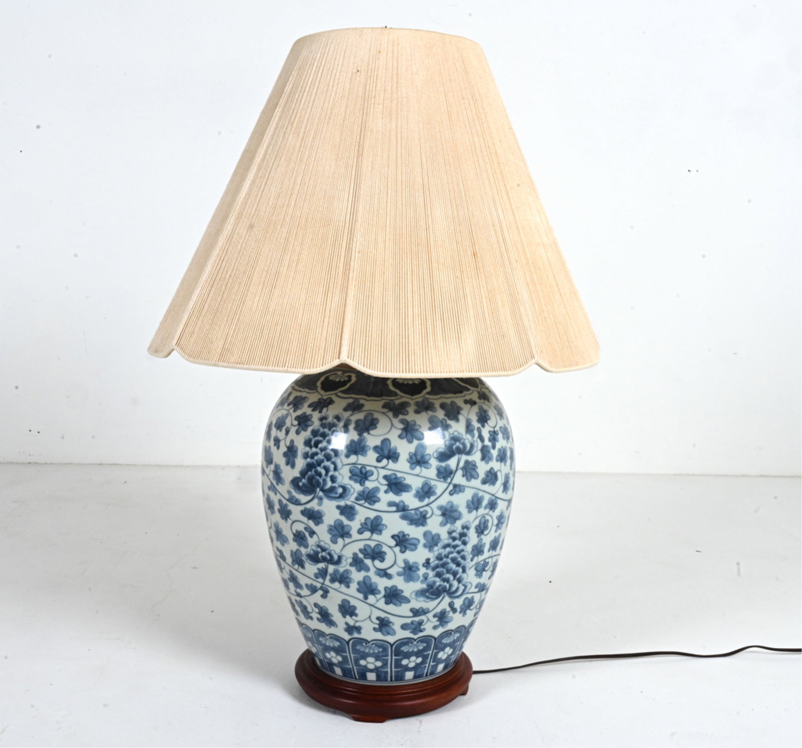 CHINOISERIE BLUE & WHITE PORCELAIN OVERSIZED LAMP: Blue and white painted porcelain oversized jar, converted into a lamp. Likely Chinese, c. 20th century. Dimensions: (w/ shade) H 32.25" x Dia. 22.5". Condition: Minor spots of discoloration. Natural c