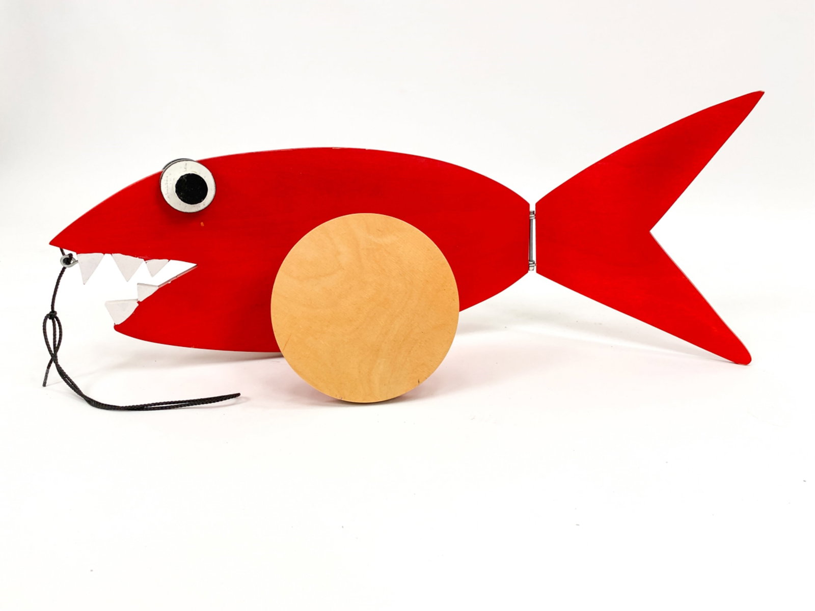 VILAC AFTER CALDER RED FISH PULL TOY: Produced by Vilac; contemporary. See Calder Foundation for similar toy from 1960. Dimensions: H 8" x W 26" x D 9" Condition: Some rubbing on the edges.