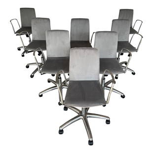 (8) CHAIRS IN THE STYLE OF JORGE PENSI: Set of 8 office chairs, made in the style of Jorge Pensi. Each chair has a 5 legs base in polished aluminum, gas cylinder elevation with tilt mechanism. A weight-activated synchro-tilt mechanism integ