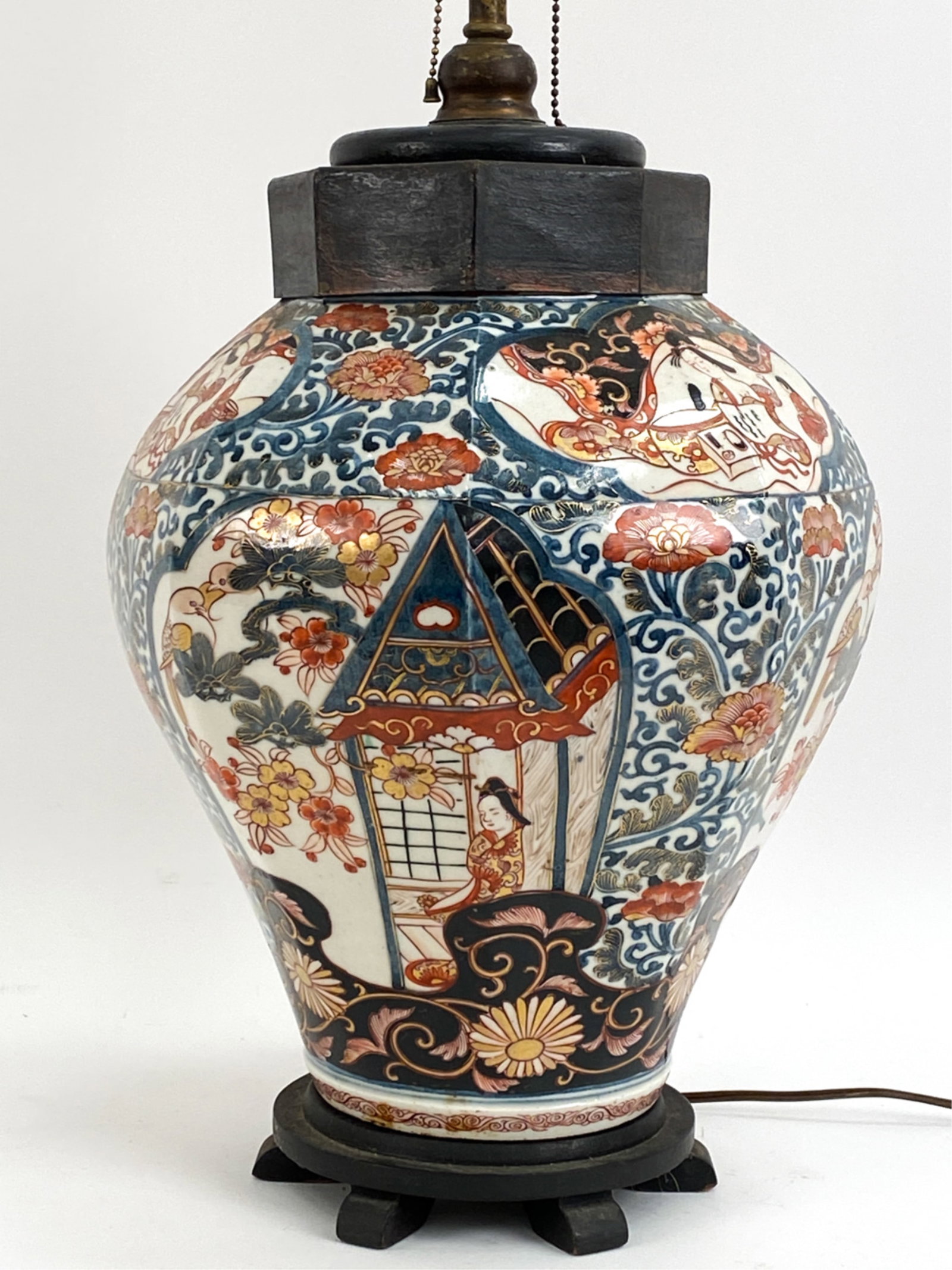 VINTAGE JAPANESE IMARI STYLE VASE AS LAMP: Octagonal vase with nude women paintings on top edges, floral decoration below. Mounted as a lamp. Dimensions: (To finial) H 32" x Dia 12" Condition: Few small losses and rubbing to vase. Untested.