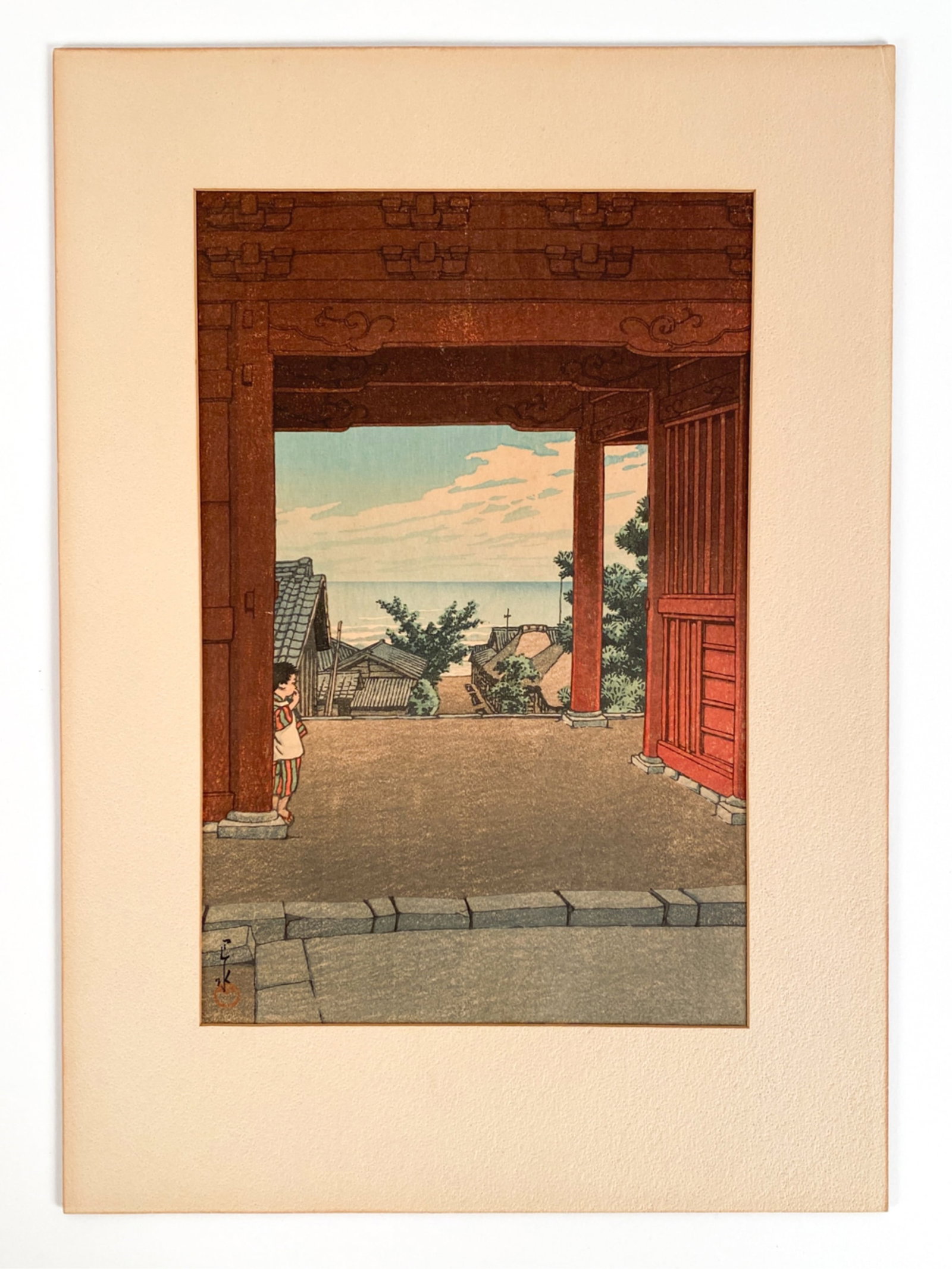 KAWASE HASUI VIEW FROM TEMPLE: Signature and seal lower left. Inscription in left and right margins. Dimensions: L 15.5" x W 10.5" Condition: Paper with some toning particularly to margins. Colors good. Hinged atop old mount.