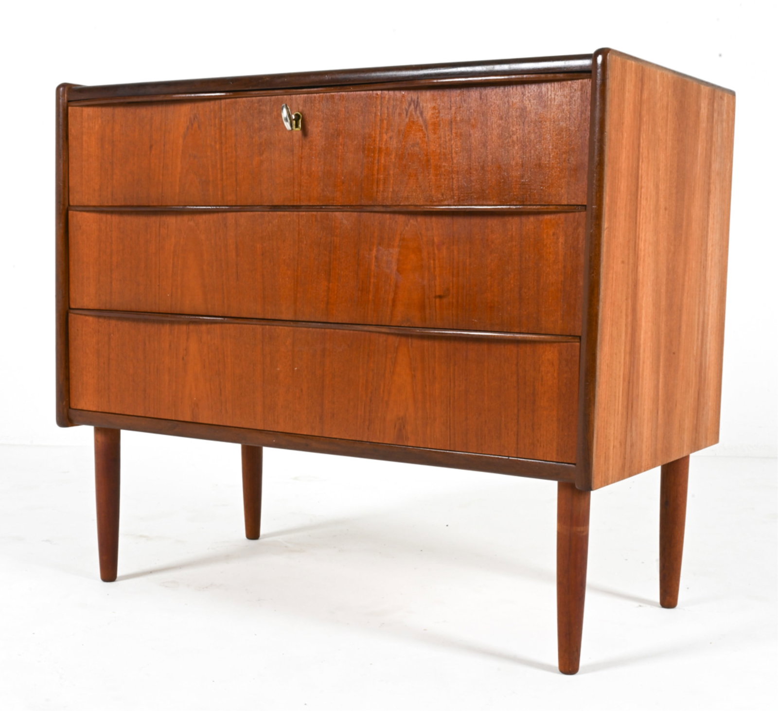 DANISH TEAK CHEST OF DRAWERS, C. 1960'S: Key included. Dimensions: H 28" x W 31.5" x D 17.75" Condition: Light wear consistent with age and use. DMD 028