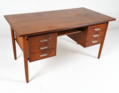 DANISH MID-CENTURY TEAK EXECUTIVE DESK: Atomic-inspired teak desk with "floating" top and brushed metal drawer handles. In style of Peter Lovig-Nielsen or Gunnar Nielsen Tibergaard. Circa 1960's. Key included. Dimensions: H 28.75" x W 57" x