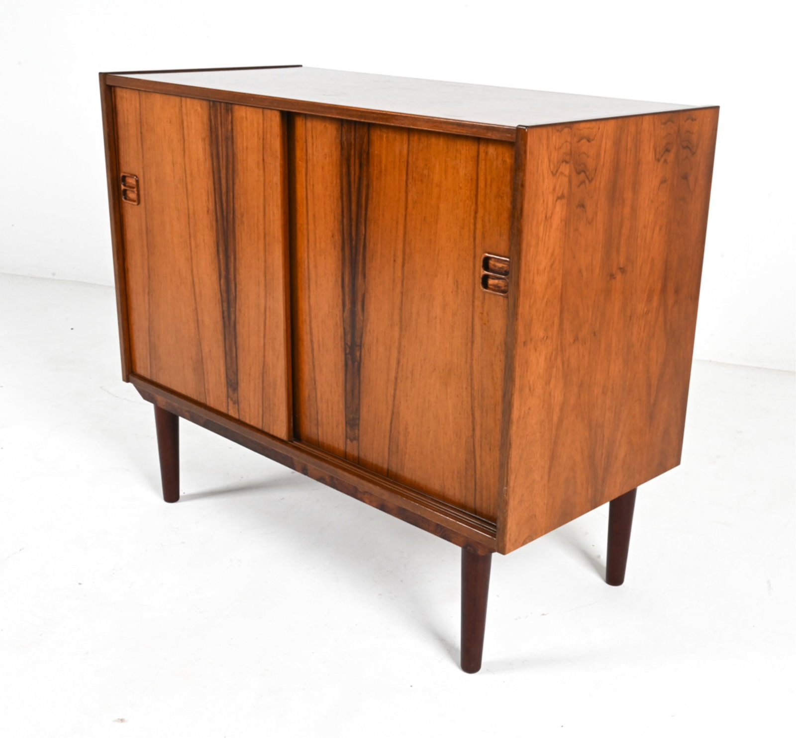 DANISH MID-CENTURY ROSEWOOD CREDENZA: Danish, circa 1960's. Dimensions: H 30" x W 35.5" x D 16.5". Condition: Legs may not be original. Minor surface scratches. Wear expected from age and use. DMD 108