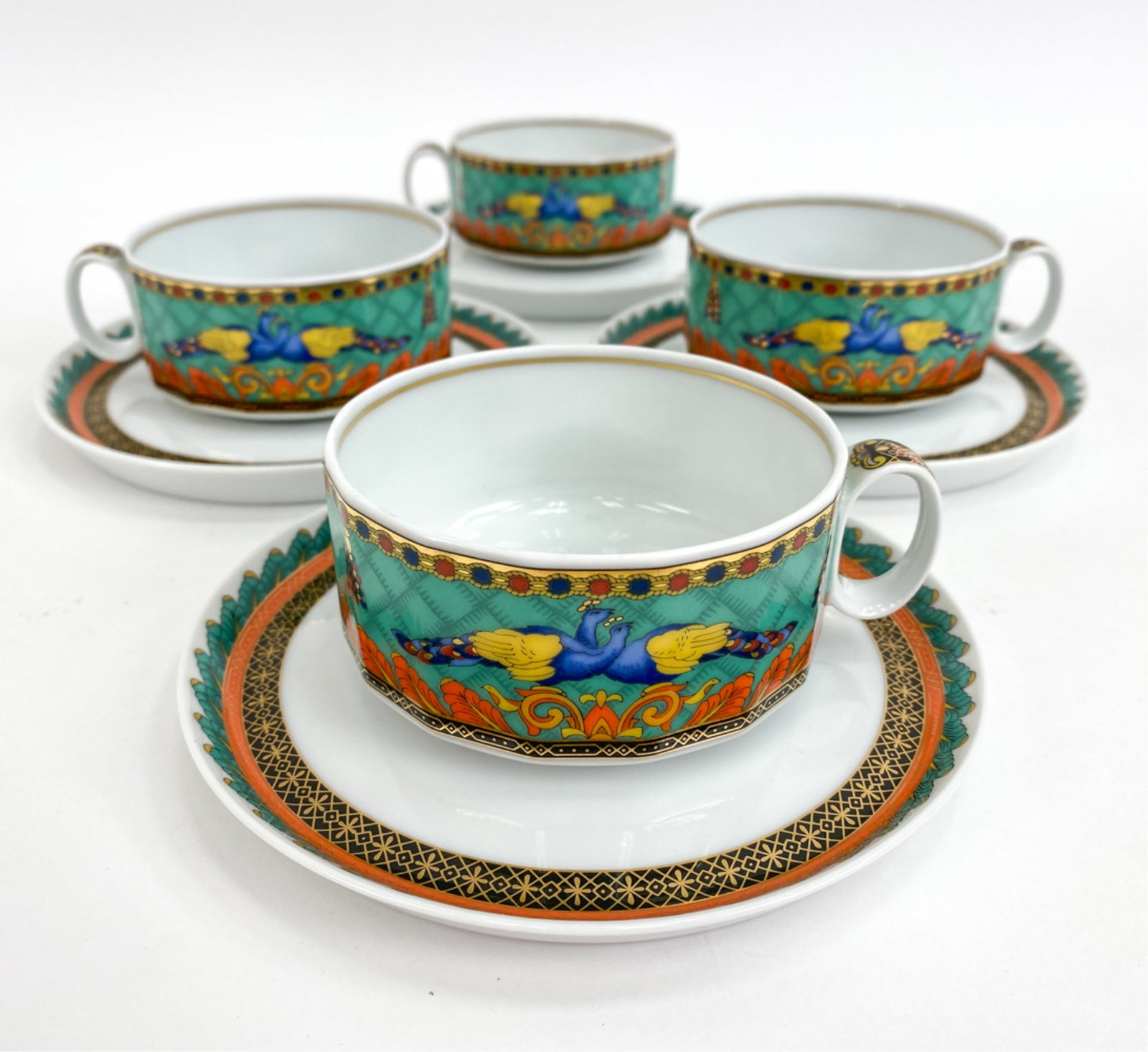 (4) VERSACE ROSENTHAL TEACUPS AND SAUCERS: Titled "The voyage of Marco polo" underneath. Dimensions: (Cups) H 1.75" x W 3.5" x D 4.5" (Saucers) Dia 6" Condition: Few light handling marks.