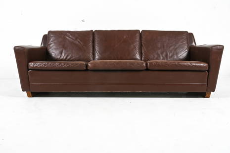 GEORG THAMS DANISH ROSEWOOD & LEATHER SOFA: Rare three-seat sofa in brown leather, with rosewood veneered runner-style legs. Designed by Georg Thams. Denmark, c. 1960's. Dimensions: H 30.75" x W 70.5" x D 27.5" x SH 18.25". Condition: Small nic