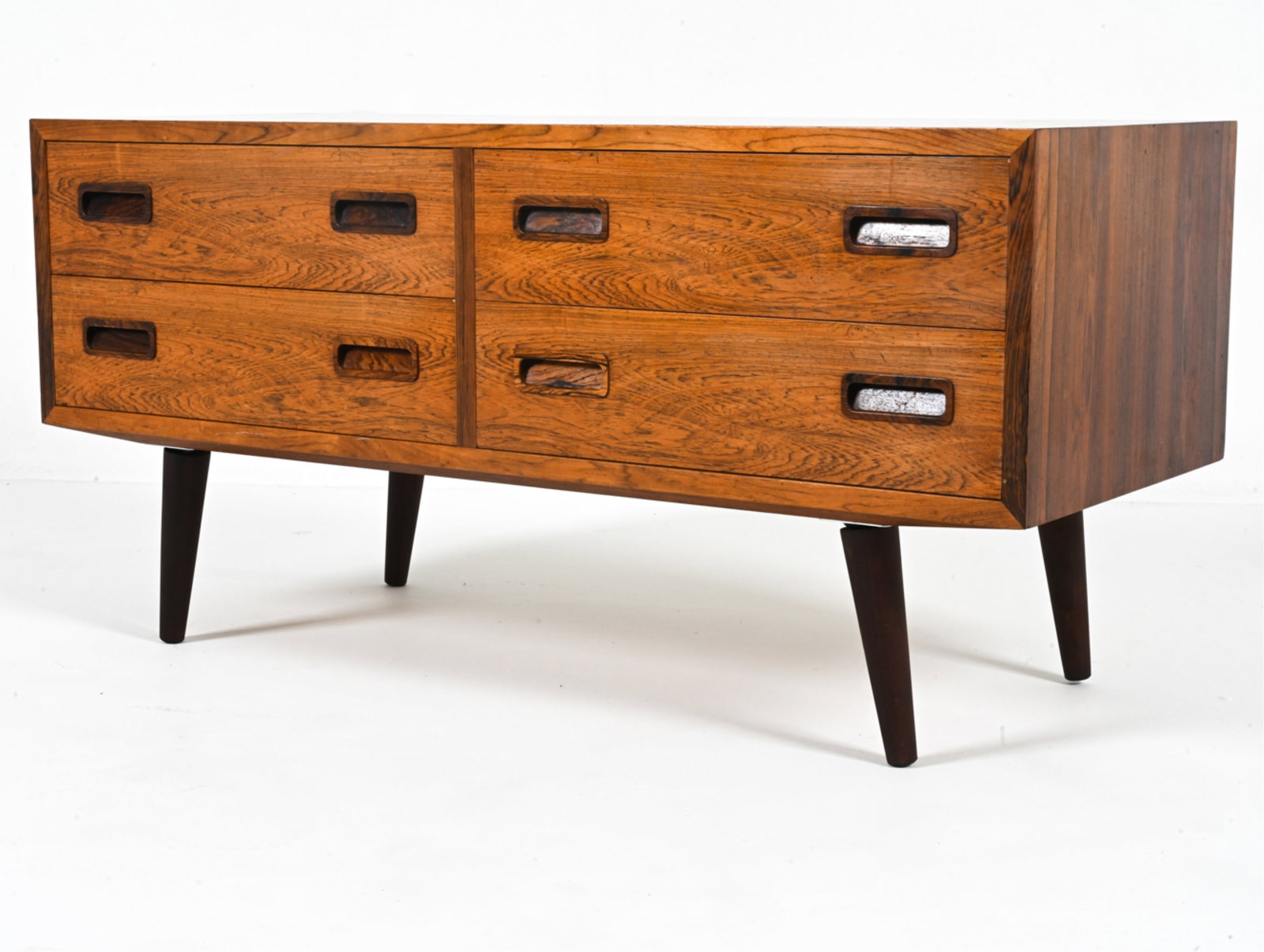 POUL HUNDEVAD DANISH ROSEWOOD HALL CHEST, 1970'S: Molded inset drawer pulls. Dovetail joints. Marked on top back left corner. c. 1970's. Dimensions: H 20.5" x W 42.5" x D 17". Condition: Legs may not be original. Minor sun fading; a few dings and scr