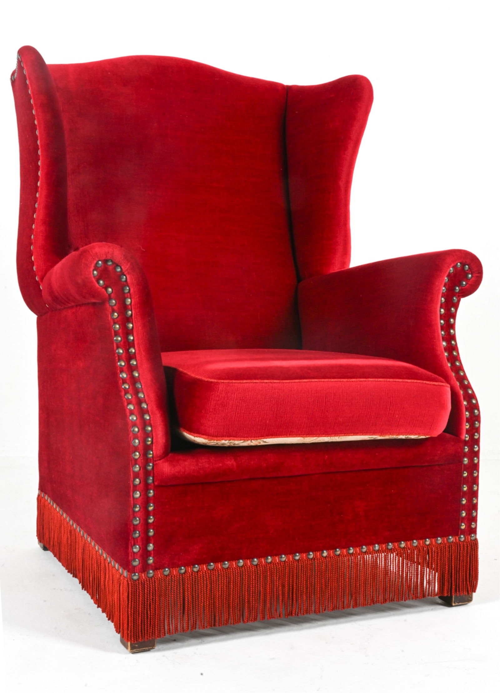 FRITS HENNINGSEN VELVET WINGBACK CHAIR: With beech legs. Brass tacks. Cushion with alternate patterned upholstery underneath. Denmark, circa 1950's. Dimensions: H 39" x W 30" x D 30.25" x SH 17". Condition: Presents well overall. Light wear