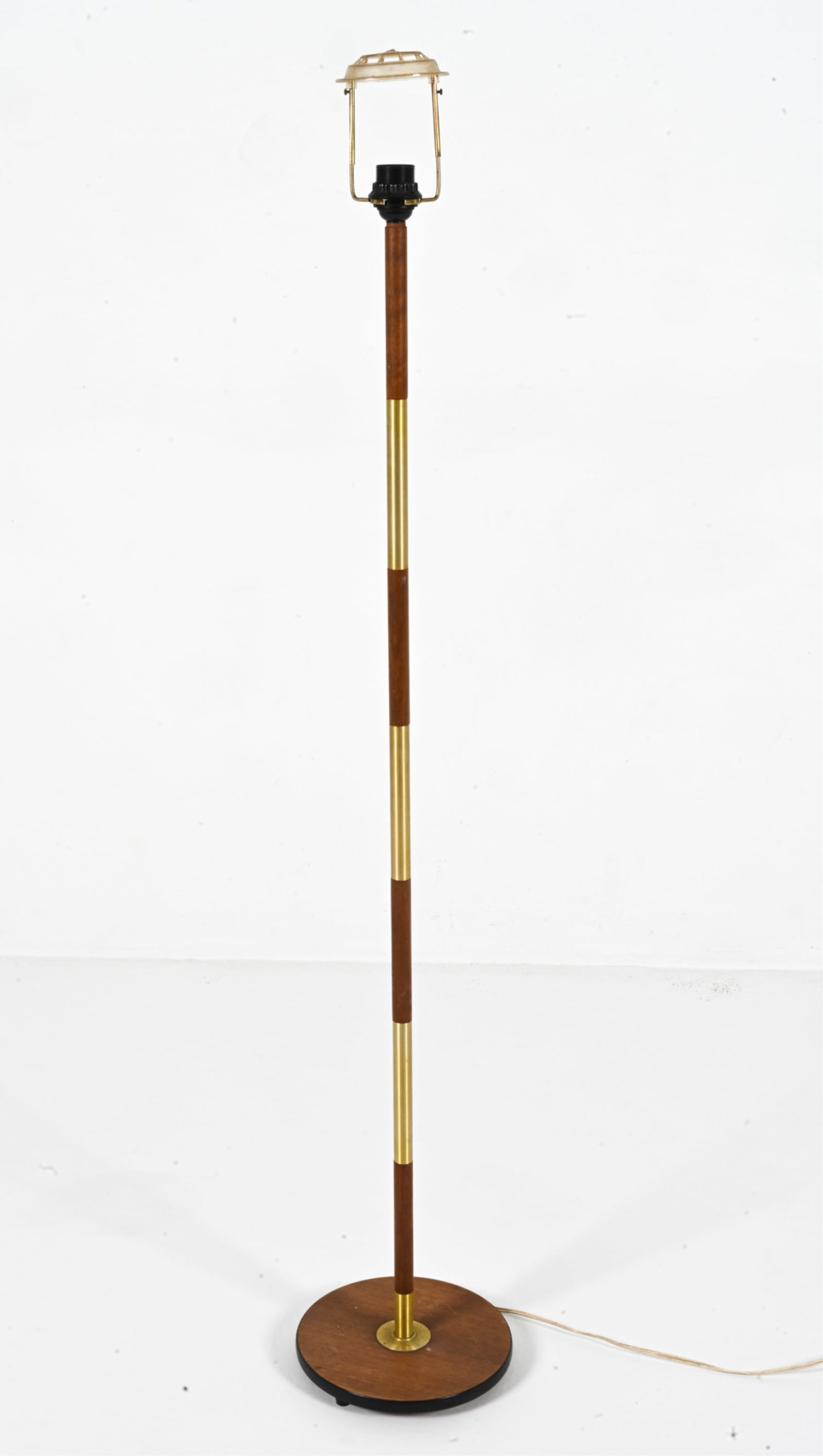 DANISH MID-CENTURY FLOOR LAMP WITH TEAK ACCENTS: Danish, circa 1960's. Dimensions: H 58.5" x Dia. 10.5". Condition: Cord cut; lamp will require rewiring. Scuffs, marks of discoloration on wood pieces.