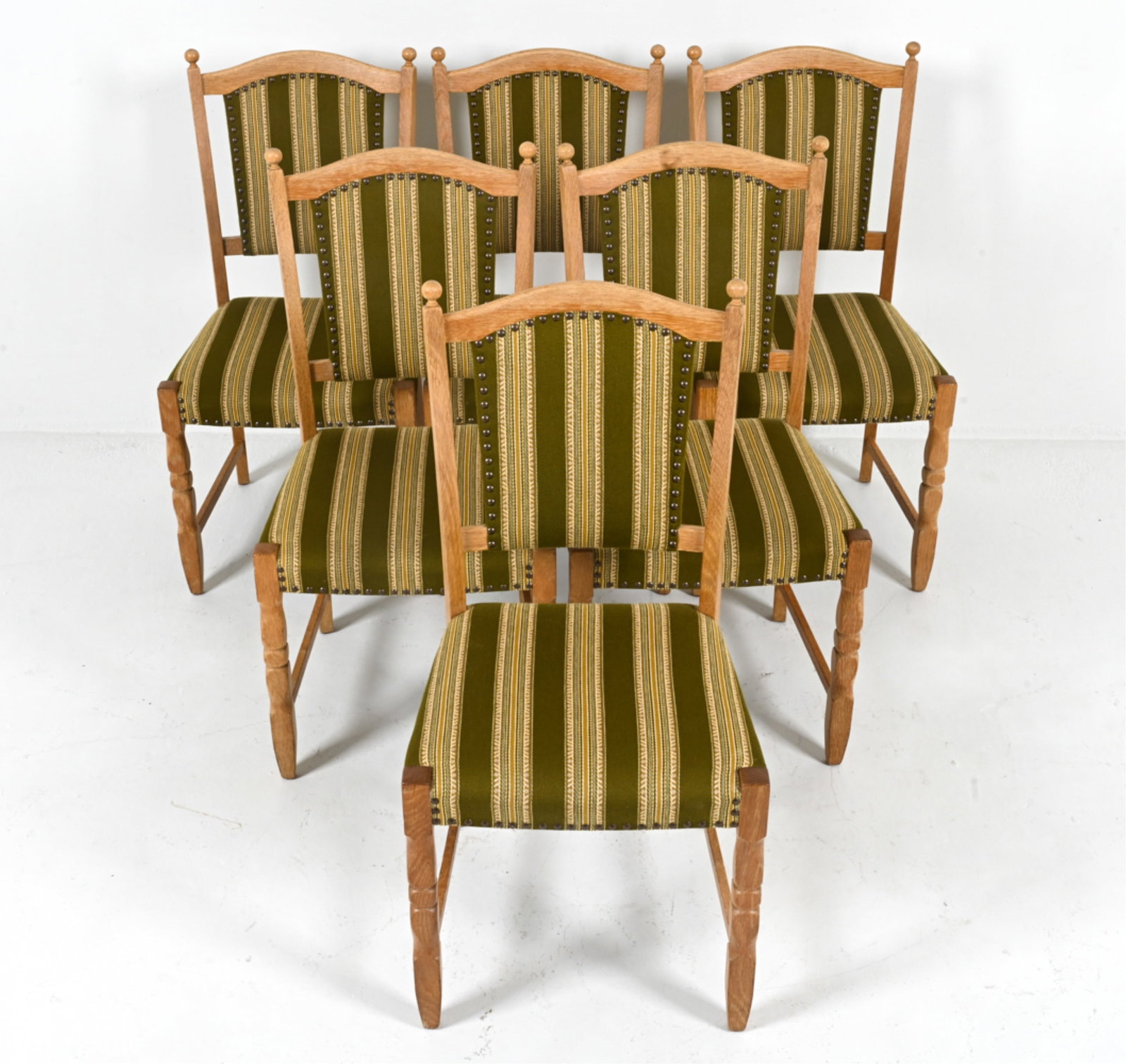 (6) MANNER OF HENNING KJAERNULF OAK DINING CHAIRS: Scandinavian, c. 1960's. Dimensions: H 37.25" x W 16.5" x D 17" x SH 1.8.25". Condition: Wear expected from age and use. B079