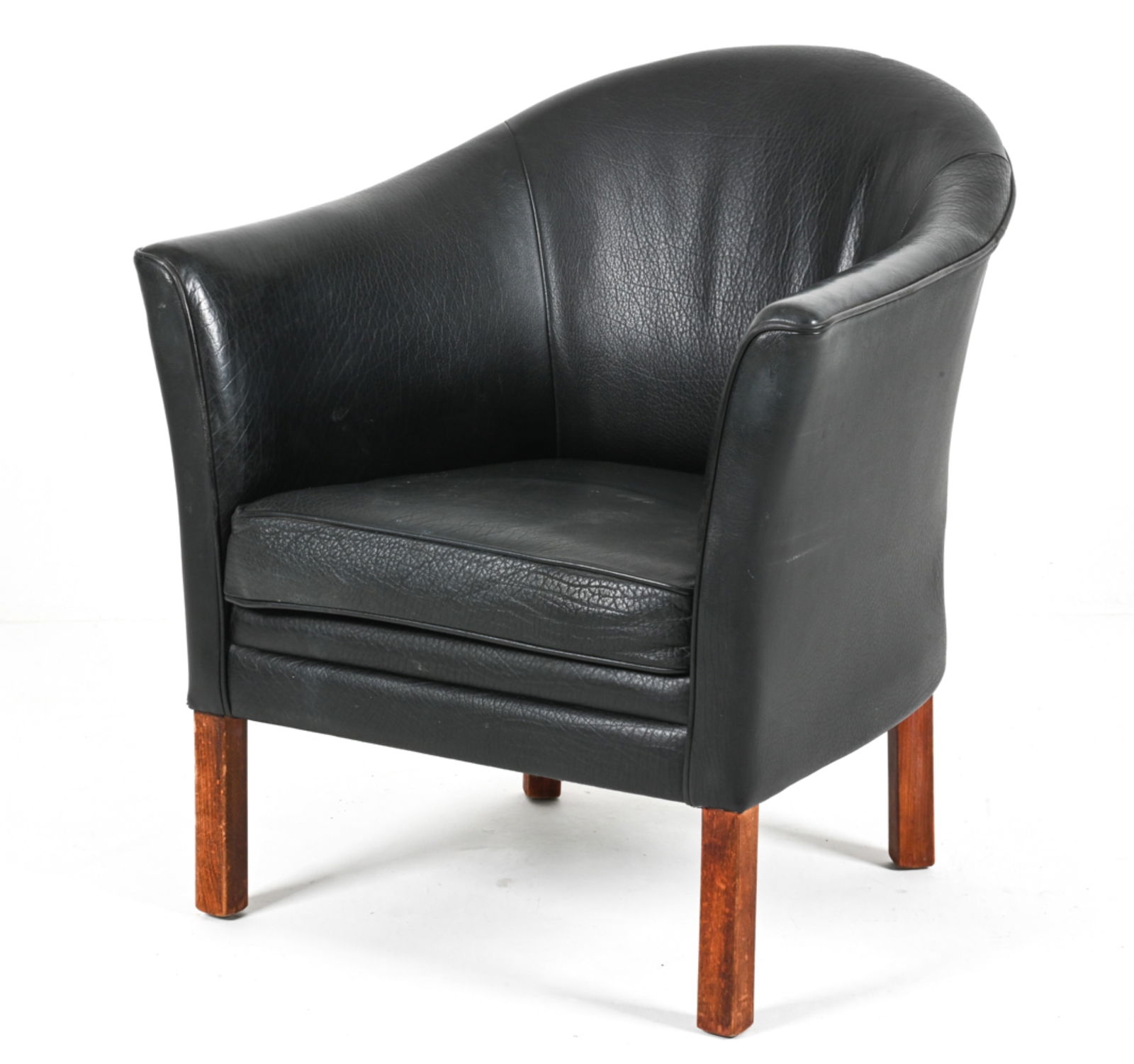 ATTR. MOGENS HANSEN BUFFALO LEATHER CLUB CHAIR: With beech legs. Denmark, c. Late 20th Century. Dimensions: H 32.5" x W 29" x D 27.5" x SH 14" Condition: Spots of minor soiling, a few indentations to leather. Nicks and scuffs to legs.