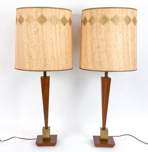 PAIR MID-CENTURY TONY PAUL STYLE TABLE LAMPS: Set of (2) Vintage table lamps. Wood and brushed brass, original shades. Dimensions: H 36" x Dia 14.5" Condition: Minor surface wear, nicks and scratches consistent with age and use. Untested.