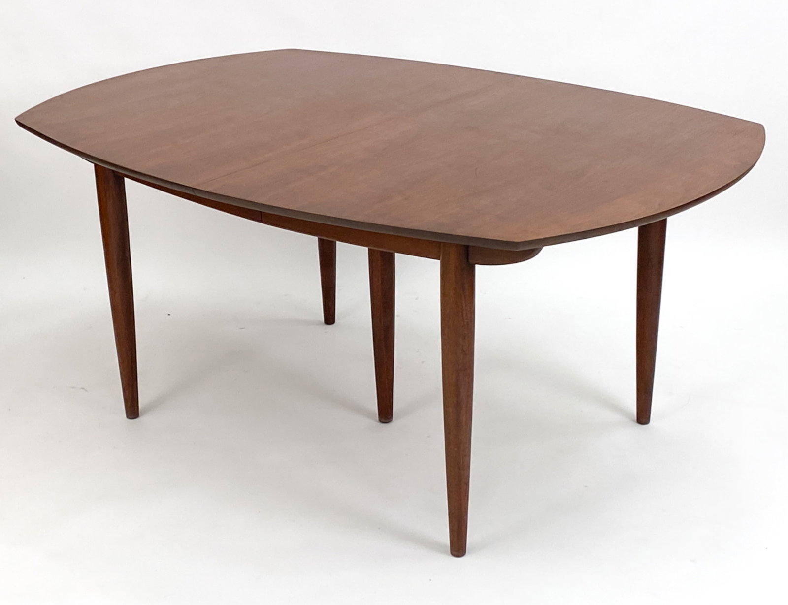 MID-CENTURY TEAK DINING TABLE: May be John Stuart, originally purchased with John Stuart chairs. Vintage teak dining table. (3) leaves included. Dimensions: (Without leaves) H 29.5" x W 65" x D 45" (Each leaf) W 18"Condition: Minor