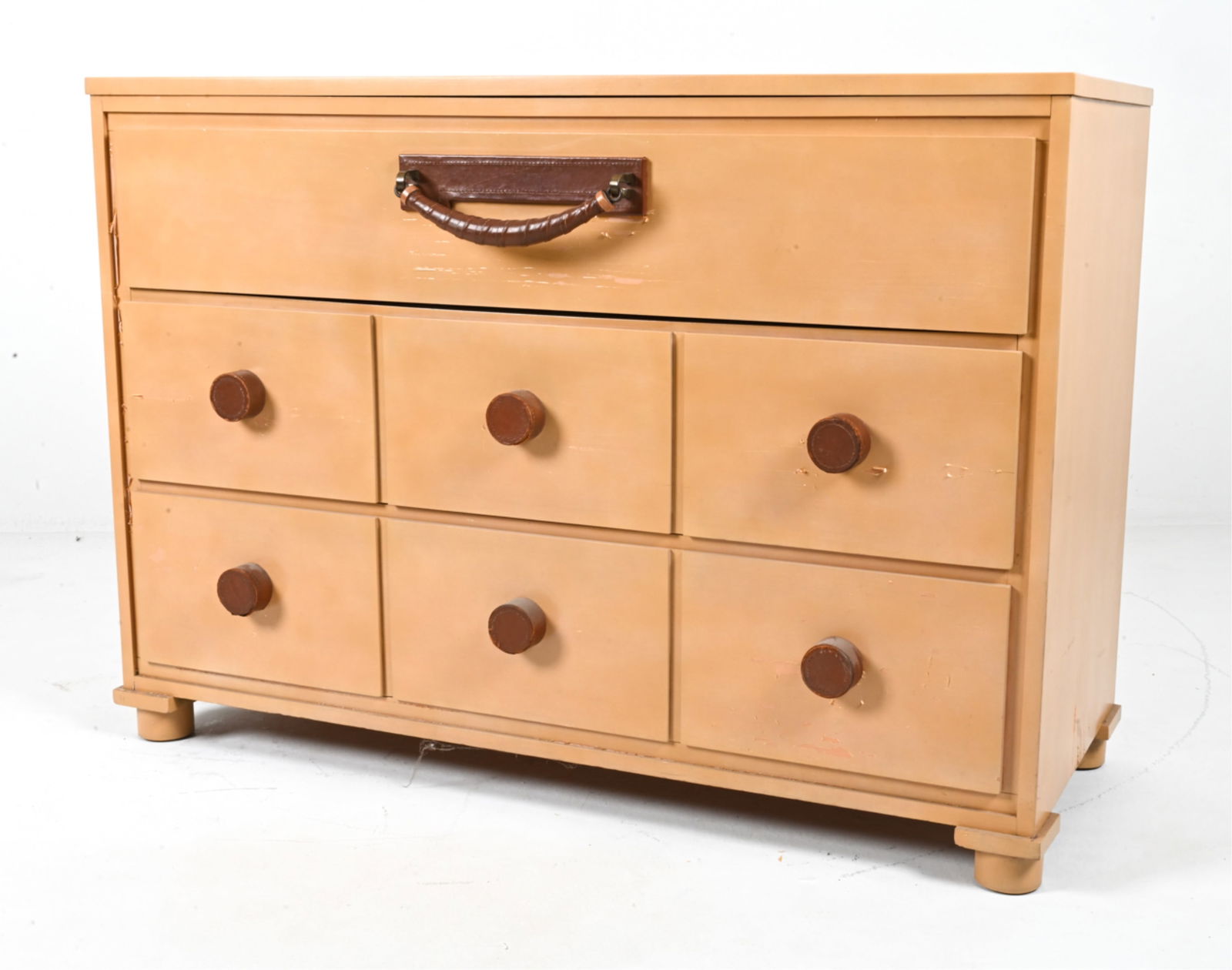 MID-CENTURY CONANT BALL CHEST, C. 1960'S: Mid-Century chest of drawers from the "American Modern" series, designed by Russel Wright for Conant Ball. Stamped inside drawer. Painted finish, leather drawer pulls and dresser feet appear to have b