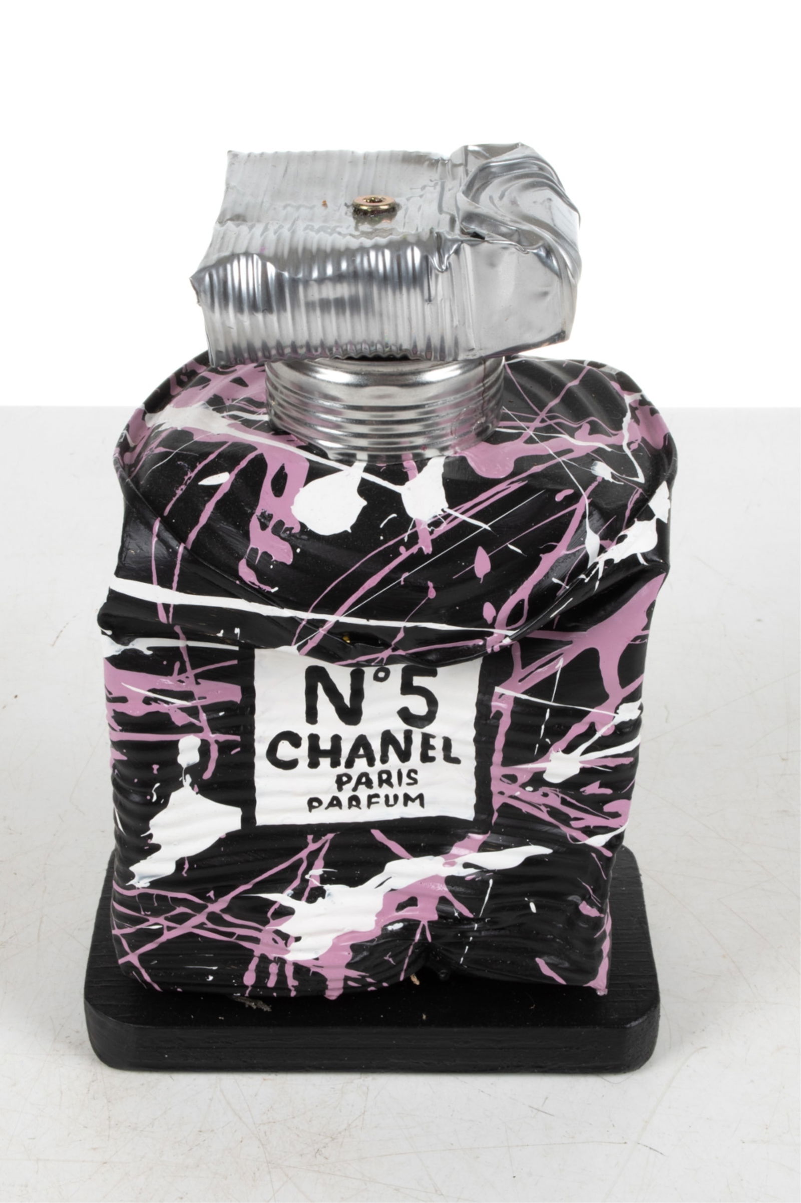 NORMAN GEKKO "CHANEL JACKSON POLLOCK NO. 5": Tin can and acrylic, on painted wood base. With COA. Signed on back. 2021. Dimensions: H 10.75" x W 7" x D 4.5" Condition: No issues to note.