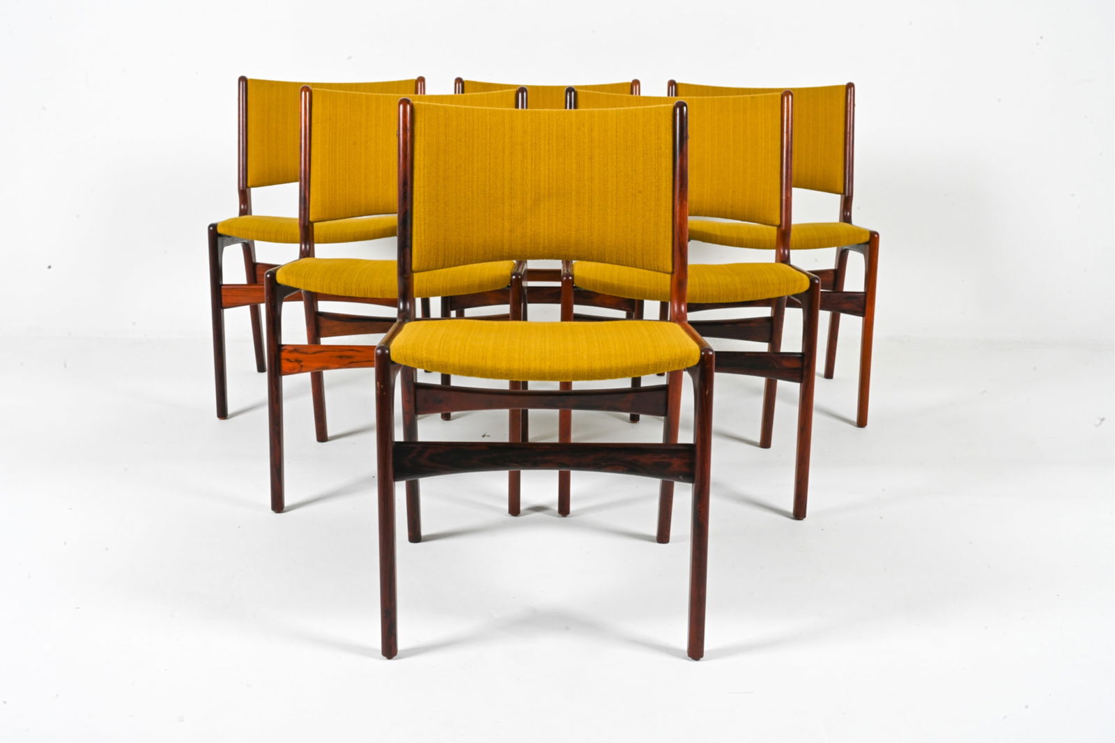 (6) ATTR. NOVA MOBLER ROSEWOOD DINING CHAIRS: Possibly designed by Erik Buch. Denmark, circa 1960's. Dimensions: H 31" x W 19" x D 17.5". SH 18". Condition: Light scrapes, scuffs to wood. DME 161