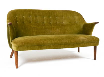 MANNER OF GEORG THAMS TEAK & MOHAIR SOFA: Cocktail sofa with subtly curved seat, featuring teak legs and paw-arms. In the manner of Georg Thams for Vejen Polstermobelfabrik. Denmark, circa 1950's. Dimensions: H 31" x W 58" x D 27". SH 15". Co