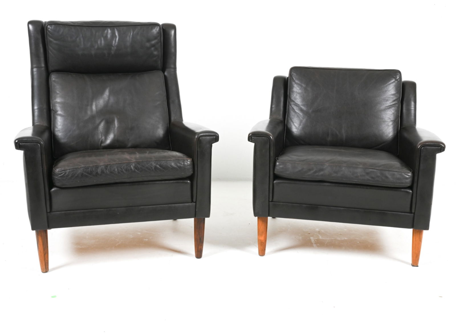 (2) MANNER OF SVEND SKIPPER LEATHER LOUNGE CHAIRS: 'His and hers' set of lounge chairs. Danish, circa 1960's. Dimensions: (Taller) H 38.5" x W 31" x D 31" x SH 17.5". Condition: Wear expected from age and use. DME 062