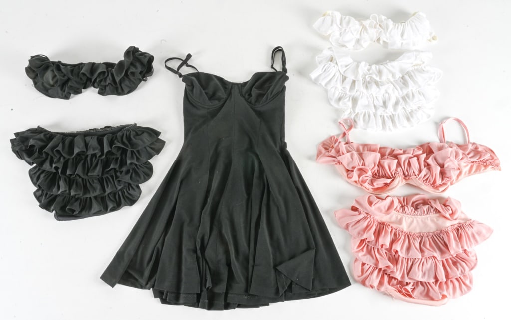 VINTAGE NORMA KAMALI RUFFLED SWIMWEAR, SIZE S: Includes: black swim dress, black bikini, pink bikini, and white bikini. All pieces labeled size S. c. 1990's. Condition: Elastic slightly stretched but still functional. Some minor discoloration. Und