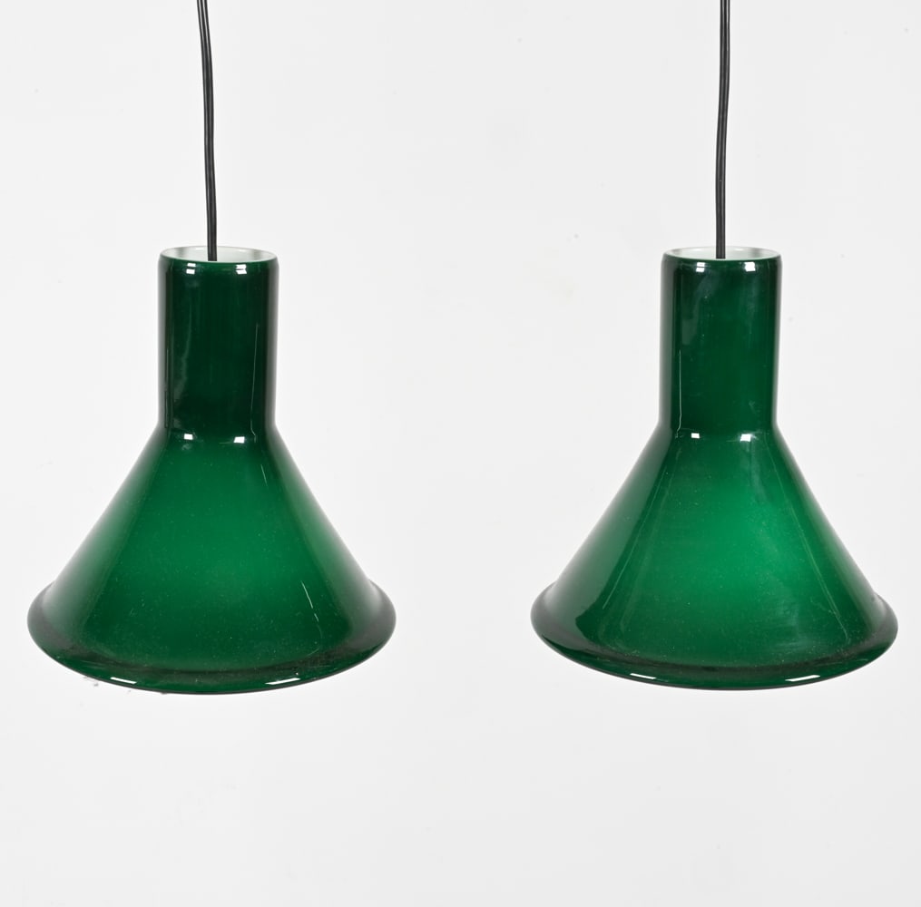 (2) MICHAEL BANG HOLMEGAARD P&T MINI PENDANTS: Green cased glass. Denmark, c. 1980's. Dimensions: H 8" x Dia. 8". Condition: Wires cut, requires rewiring for use.