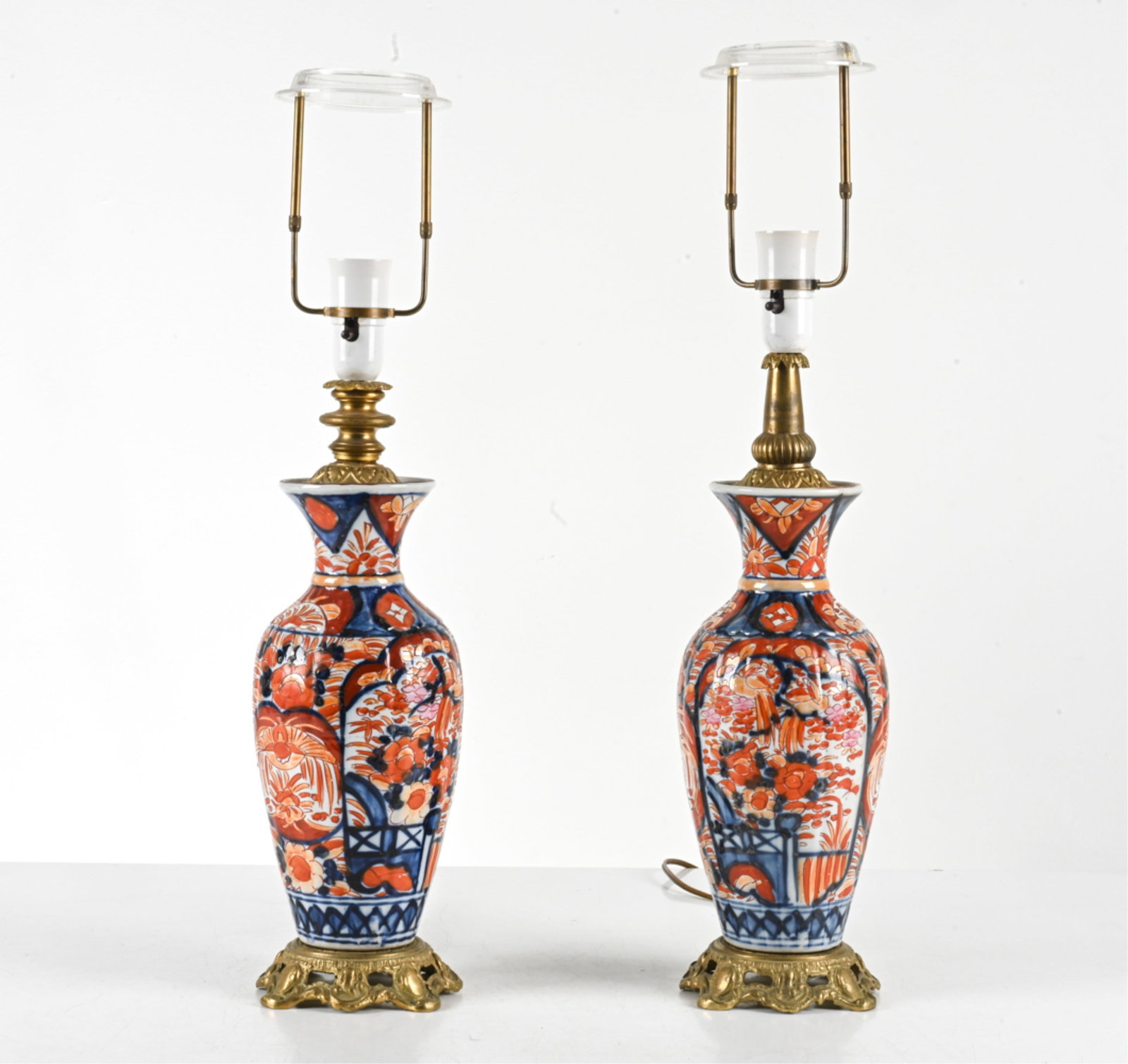 (2) JAPANESE IMARI PORCELAIN LAMPS: Vases converted into lamps. Mounted on brass stands. 20th century. Dimensions: H 23.25" x Dia. 5.5". Condition: Wires cut, require rewiring. C027
