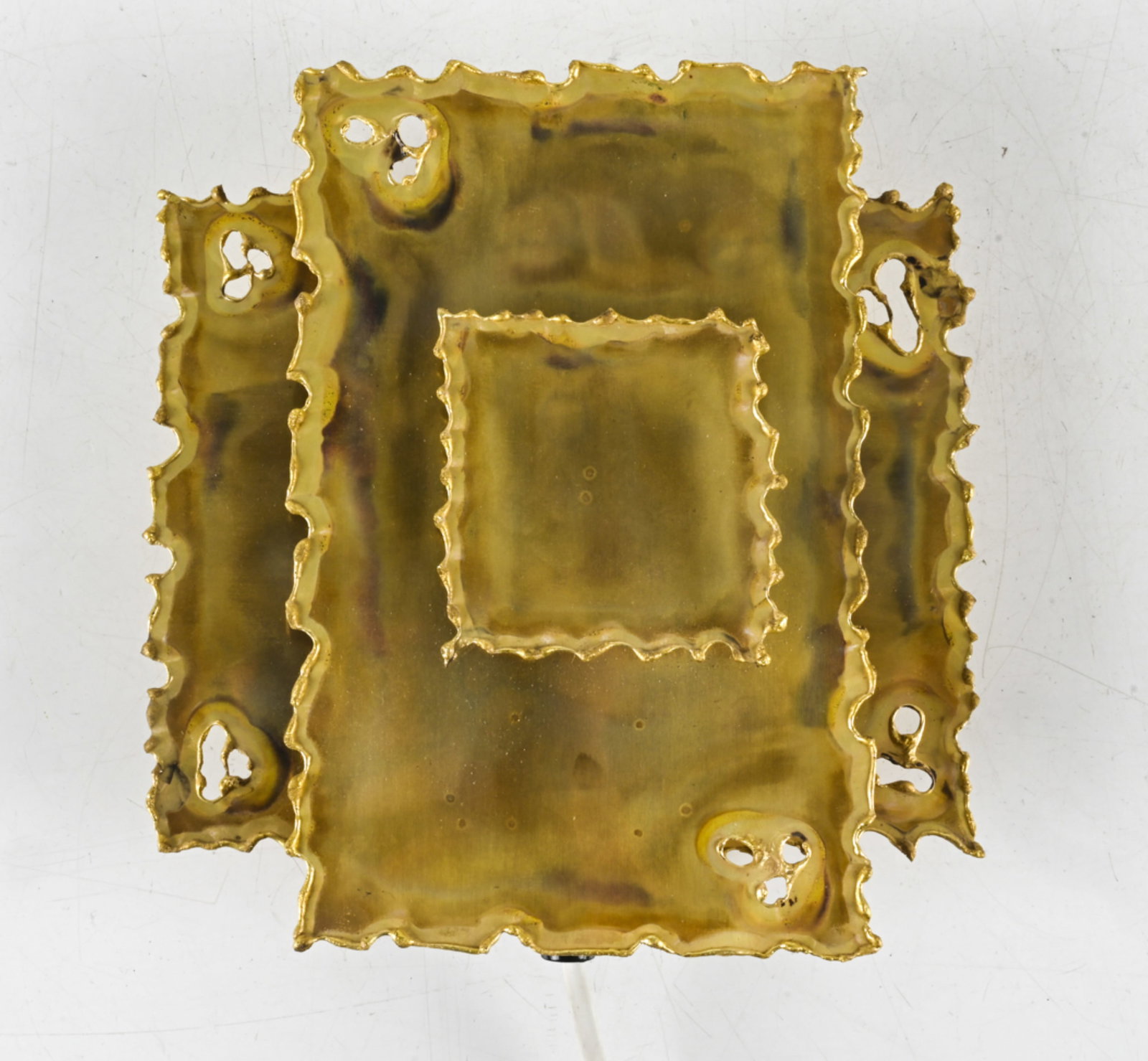 SVEND AAGE HOLM SORENSEN TORCH-CUT BRASS SCONCE: With Pedersen Belysning. Denmark, circa 1970's. Dimensions: H 8.5" x W 8.25" x D 3". Condition: Wire cut, requires rewiring. C108