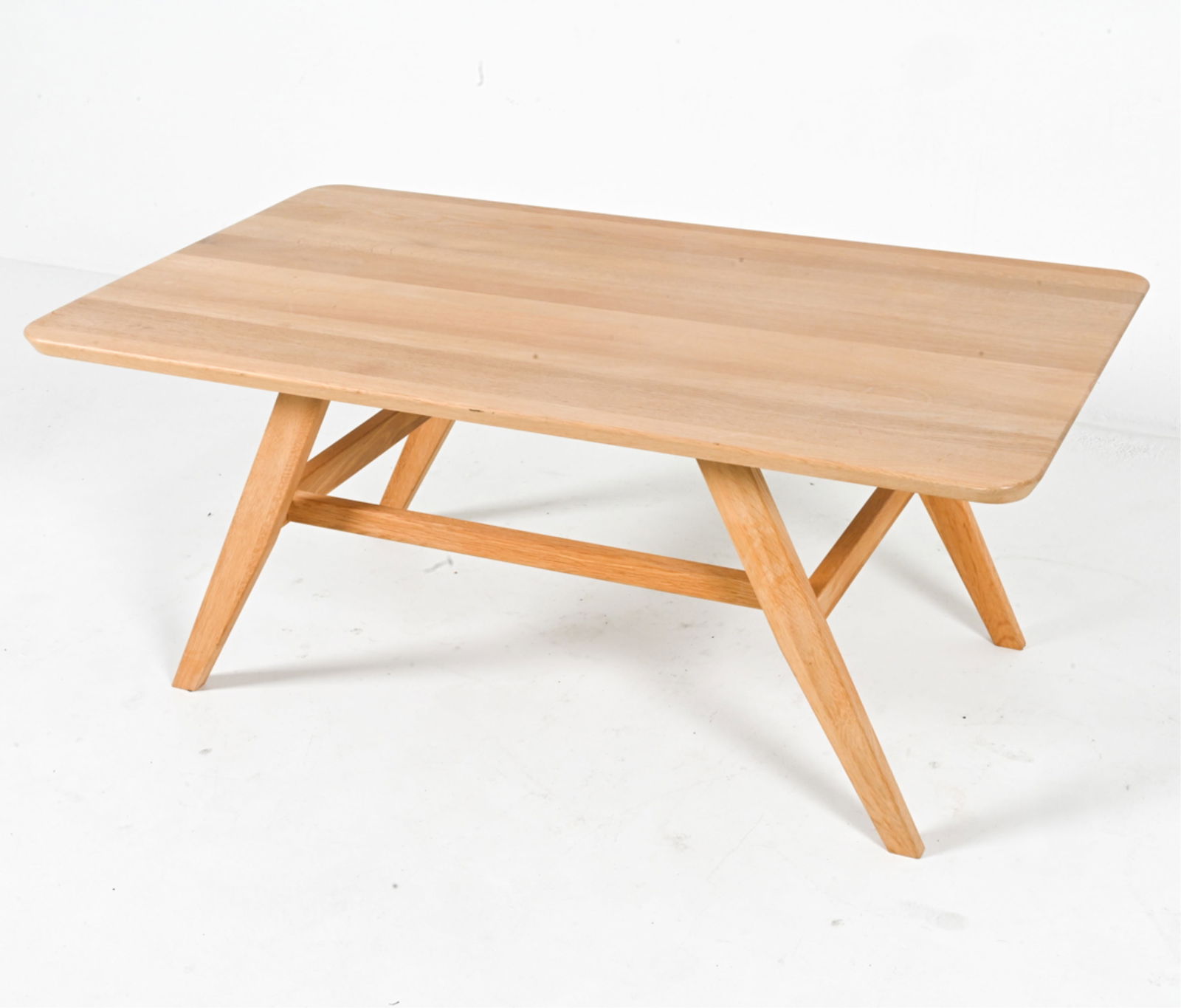 HASLEV DANISH MODERN BLEACHED OAK COCKTAIL TABLE: With extra brackets underneath top for adjustment of legs. Late 20th or early 21st century. Dimensions: H 19.5" x W 47" x D 27.75". Condition: Faint scuffs and scrapes on legs. Small spots of discolor