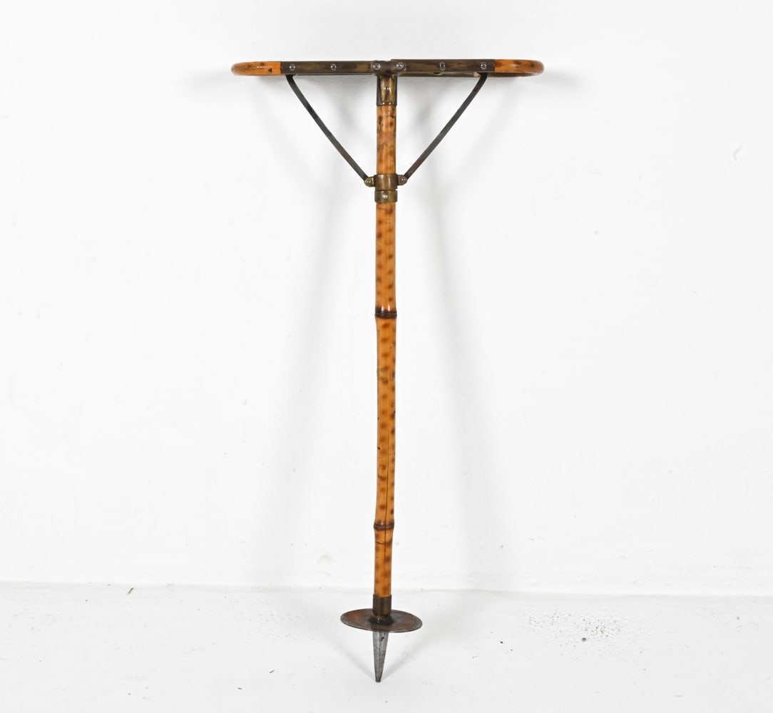 ANTIQUE BAMBOO SHOOTING STICK: Bamboo, woven rattan and metal. Dimensions: (Folded) H 34" x W 4.5" x D 4". Condition: Splits to bamboo; natural patination to metal. Wear consistent with age.