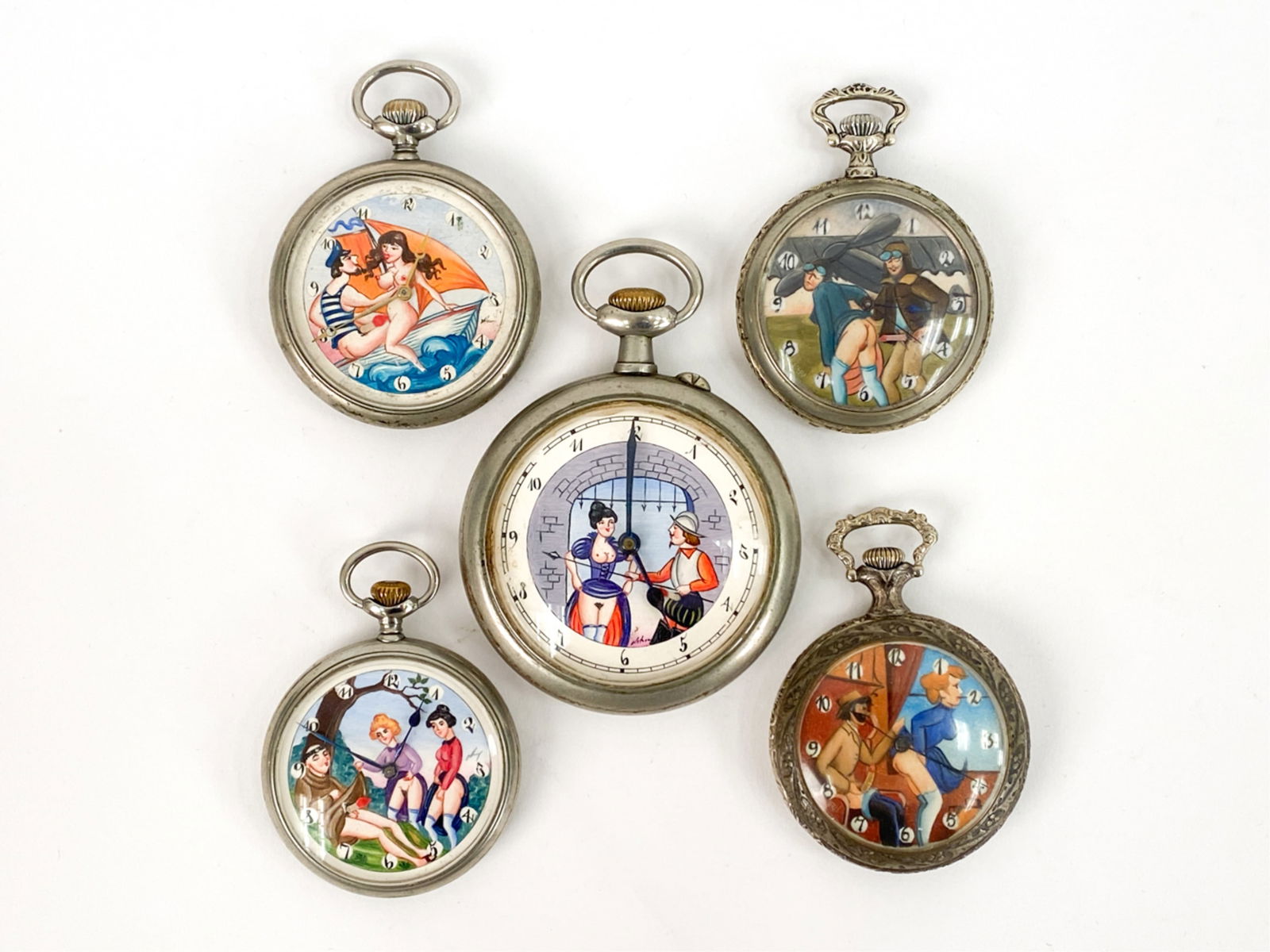 (3) DOXA EROTIC POCKET WATCHES + OTHERS: 3 internally marked Doxa, one marked Lacy watch Co, one other marked. 3 Doxas with plain backs. Other two, one with steam engine and other with football players. Dimensions: (Largest) Dia 2.75" Condit