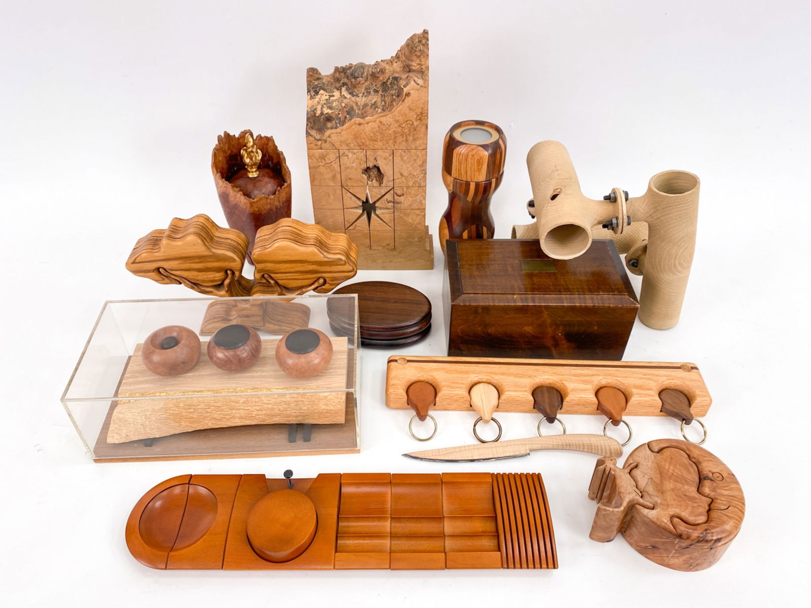 GROUPING OF HAND CRAFTED WOODEN OBJECTS: Including signed puzzle boxes by Rothbard, Redwood, France desk set, signed lidded wooden vessel by Hein, Michael Elkan one of a kind burl box, hand crafted wood kaleidoscope, and signed wood sculptur