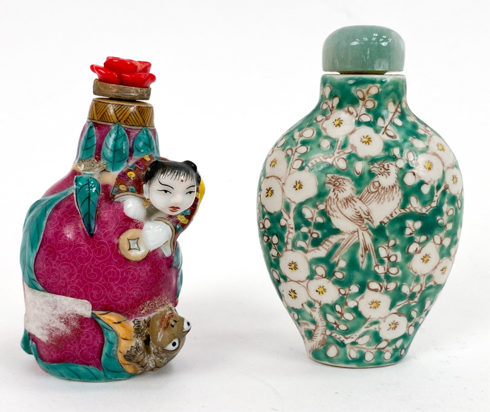 (2) CHINESE PORCELAIN SNUFF BOTTLES: One 3-dimensional figure and animal, marked underneath. Other with birds and foliage, marked underneath. Both stoppers appear to be replacements. Dimensions: H 3" x W 1.75" x D 1" Condition: 3d with l