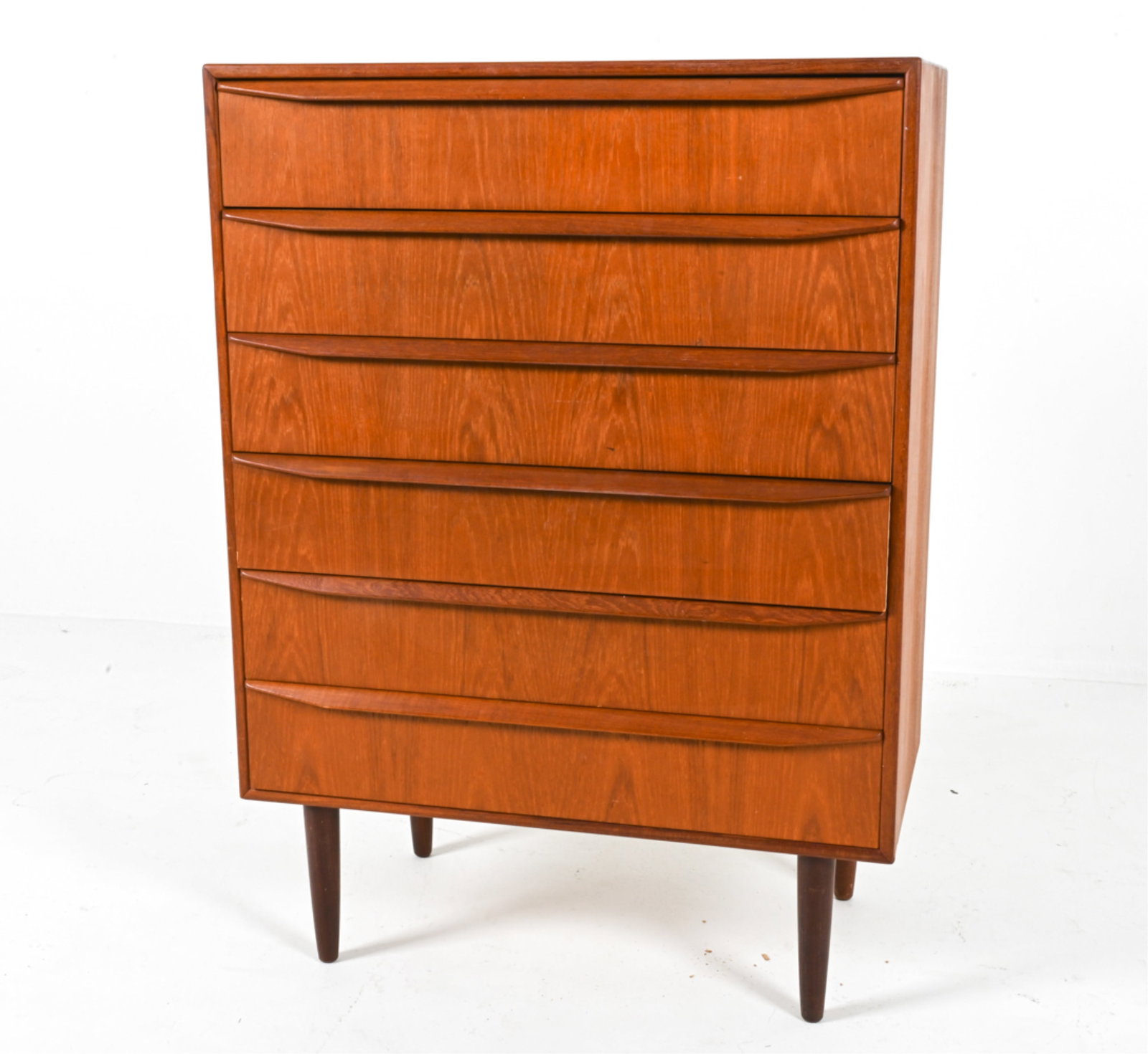 DANISH TEAK CHEST OF DRAWERS, C.1970'S: Long sculpted drawer pulls. Dimensions: H 42.75" x W 30.75" x D 16". Condition: Light surface scratches and scuffs, great presentation overall. A173