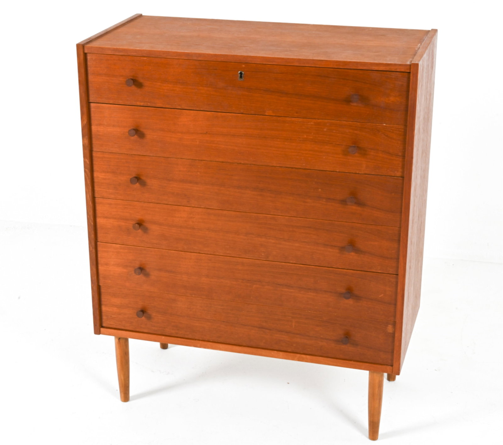 DANISH TEAK CHEST OF DRAWERS, C.1970'S: With conical wooden drawer pulls. Dimensions: H 38.25" x W 31.25" x D 15.5". Condition: Key not included. Some scuffs and scrapes on top. A216