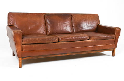 MANNER OF GEORG THAMS ROSEWOOD & LEATHER SOFA: Denmark, c. 1950's. Dimensions: H 29" x W 74" x D 33.5" x SH 17.5". Condition: Leather with natural patination and wear, including scuffing, creases, and rubs; a few nicks and minor surface losses at
