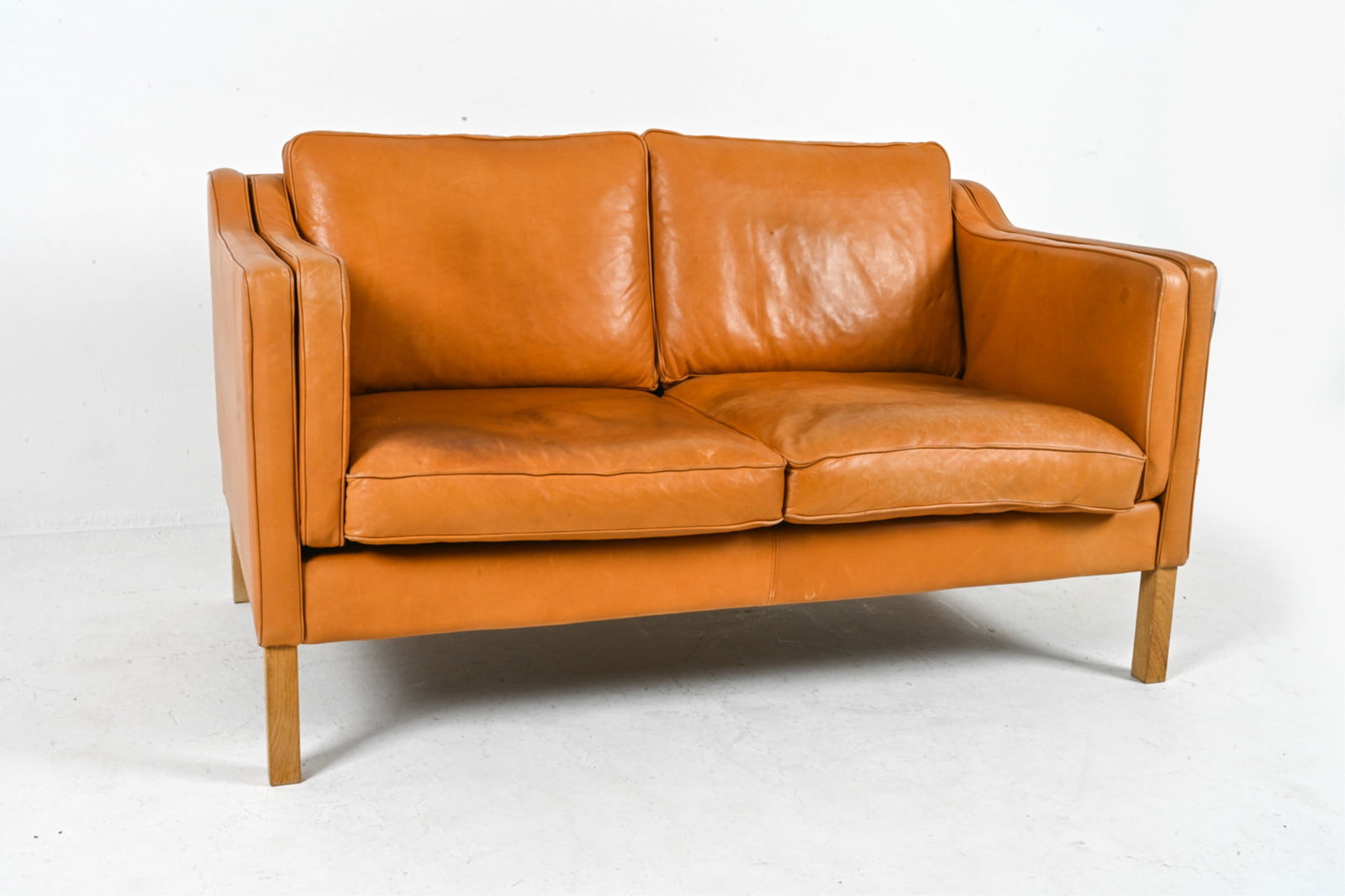 MANNER OF MOGENS HANSEN LEATHER TWO-SEAT SOFA (1 of 18)