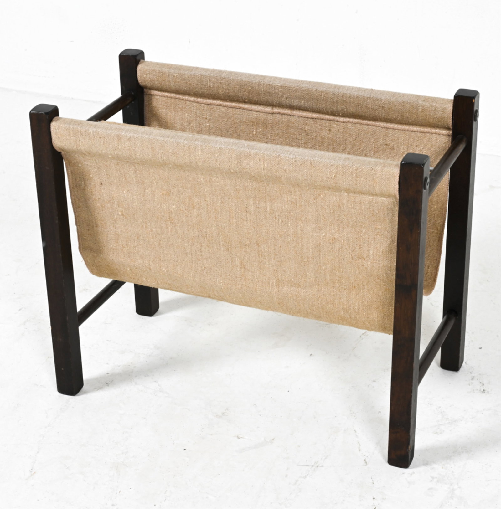 SCANDINAVIAN BEECH & CANVAS MAGAZINE RACK: Beech wood finished in dark espresso stain. Scandinavian, c. 1970's. Dimensions: H 16.25" x W 19.75" x D 10.25" Condition: Scattered nicks and scuffs to wood; a few small marks. Presents well overall.