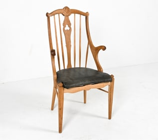 MANNER OF H. KJAERNULF DANISH OAK ARMCHAIR