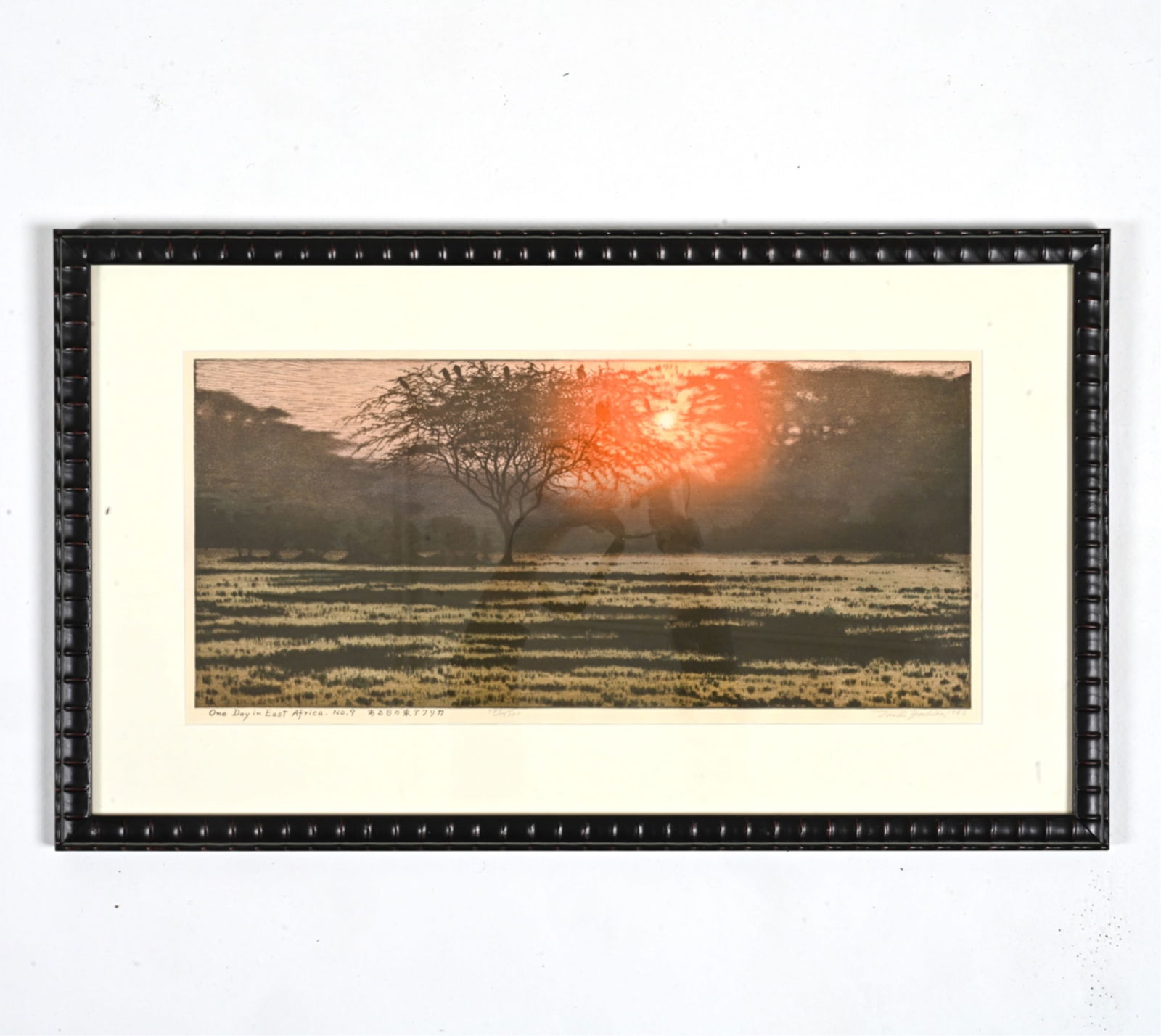 TOSHI YOSHIDA, JAPANESE (1911-1995) WOODBLOCK: "One Day in East Africa, No. 9" Editioned 983/1000, hand-signed and dated 1983 in pencil along lower margin. Dimensions: (Frame) H 19" x W 31.75" ; (Sight) H 11" x W 24". Condition: Not examined out o