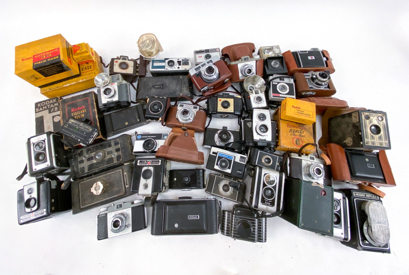 VINTAGE KODAK CAMERAS INCL. WALTER DORWIN TEAGUE: Large grouping of Kodak cameras & accessories. 49 + mostly cameras. Grouping includes Art Deco Bantam camera designed by Walter Dorwin Teague, KODAK Six-16 bellows folding camera c. 1930's, several Ko