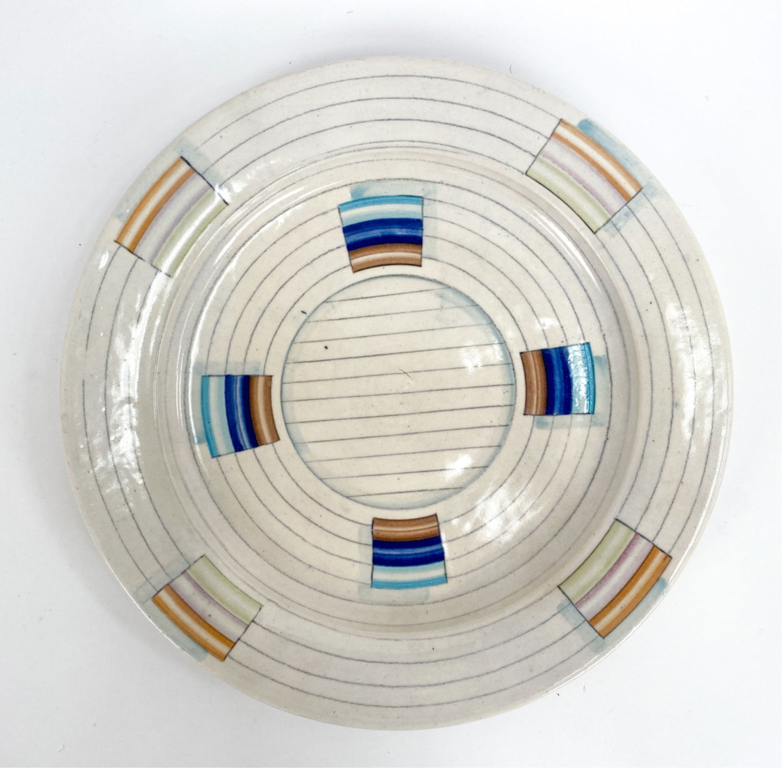 STONEWARE STUDIO POTTERY PLATE: Indistinctly signed underneath very lightly. Thrown and glazed. Was purchased at Rhinebeck Craft Fair in the 1980's. Dimensions: H 1.25" x Dia 14" Condition: Some bottom roughness.