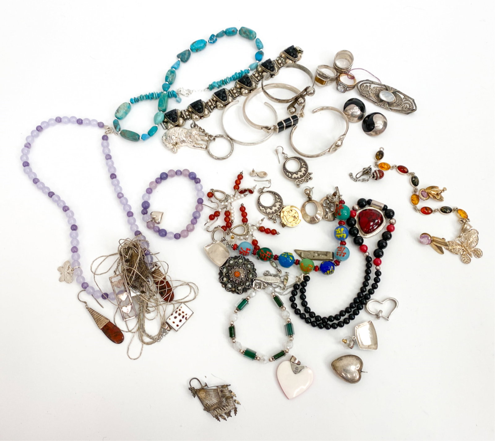 JEWELRY INCL. MEXICAN STERLING SIVLER & TIFFANY: Includes a few pieces of costume jewelry, many pieces of Mexican sterling, a couple Italian sterling, and a Tiffany & Co. heart pendent. Total weight of items with silver 10.9ozt. Dimensions: (Longest