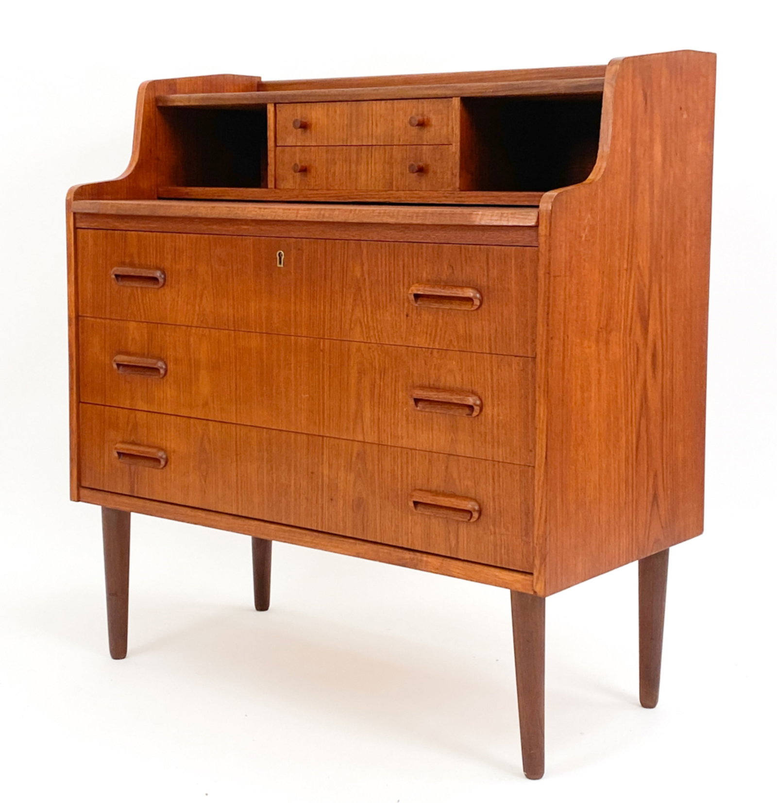MID-CENTURY DANISH TEAK SECRETARY: Teak secretary with pull-out desktop, circa 1960's. Key included. Unsigned. Dimensions: H 36" x W 33.5" x D 16.5" Condition: Couple losses to back of proper left side top. Few scattered dings. D066