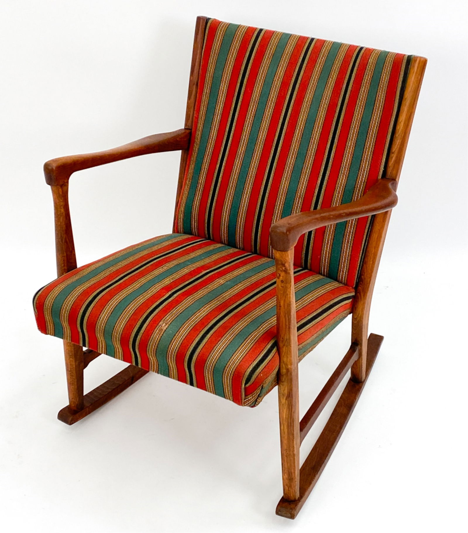 FRITZ HANSEN STYLE TEAK ROCKING CHAIR, C.1950: Attributed to Fritz Hansen striped upholstered rocking chair in a teak frame. Unsigned. Dimensions: H 30.25" x W 23.5" x D 28" x SH 16" Condition: Some marks/finish wear. Few loose threads to fabric.
